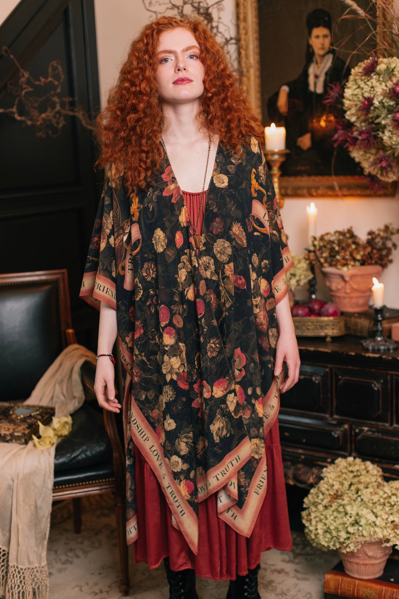 Model wearing a flowy bamboo-viscose duster featuring a collage of antique artwork with romance, loyalty, and old-world beauty - Market of Stars