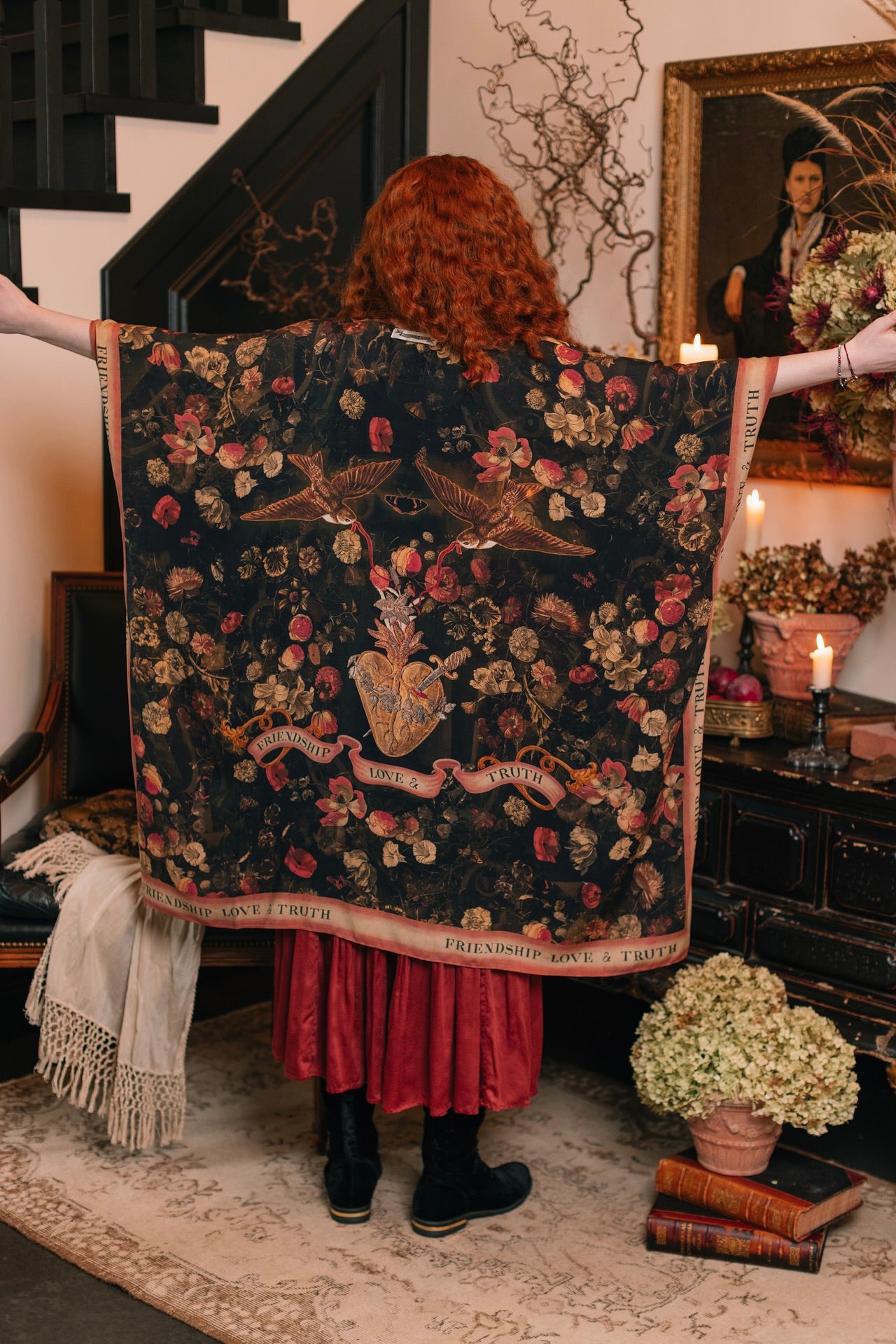 Model wearing a flowy bamboo-viscose duster featuring a collage of antique artwork with romance, loyalty, and old-world beauty - Market of Stars