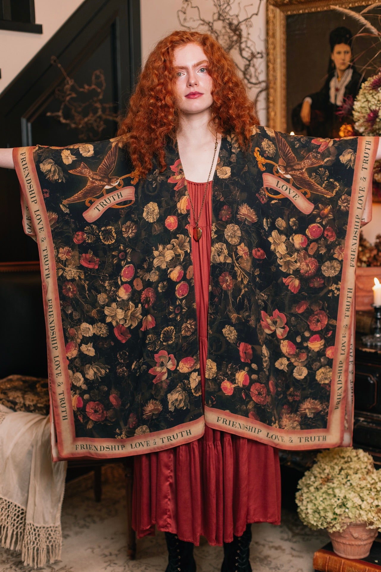 Model wearing a flowy bamboo-viscose duster featuring a collage of antique artwork with romance, loyalty, and old-world beauty - Market of Stars