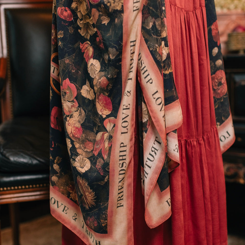 
                  
                    Model wearing a flowy bamboo-viscose duster featuring a collage of antique artwork with romance, loyalty, and old-world beauty - Market of Stars
                  
                