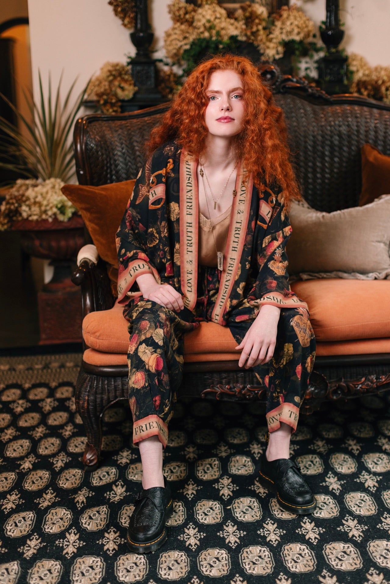 Model wearing a cropped-length bamboo-viscose duster featuring a collage of antique artwork with romance, loyalty, and old-world beauty - Market of Stars