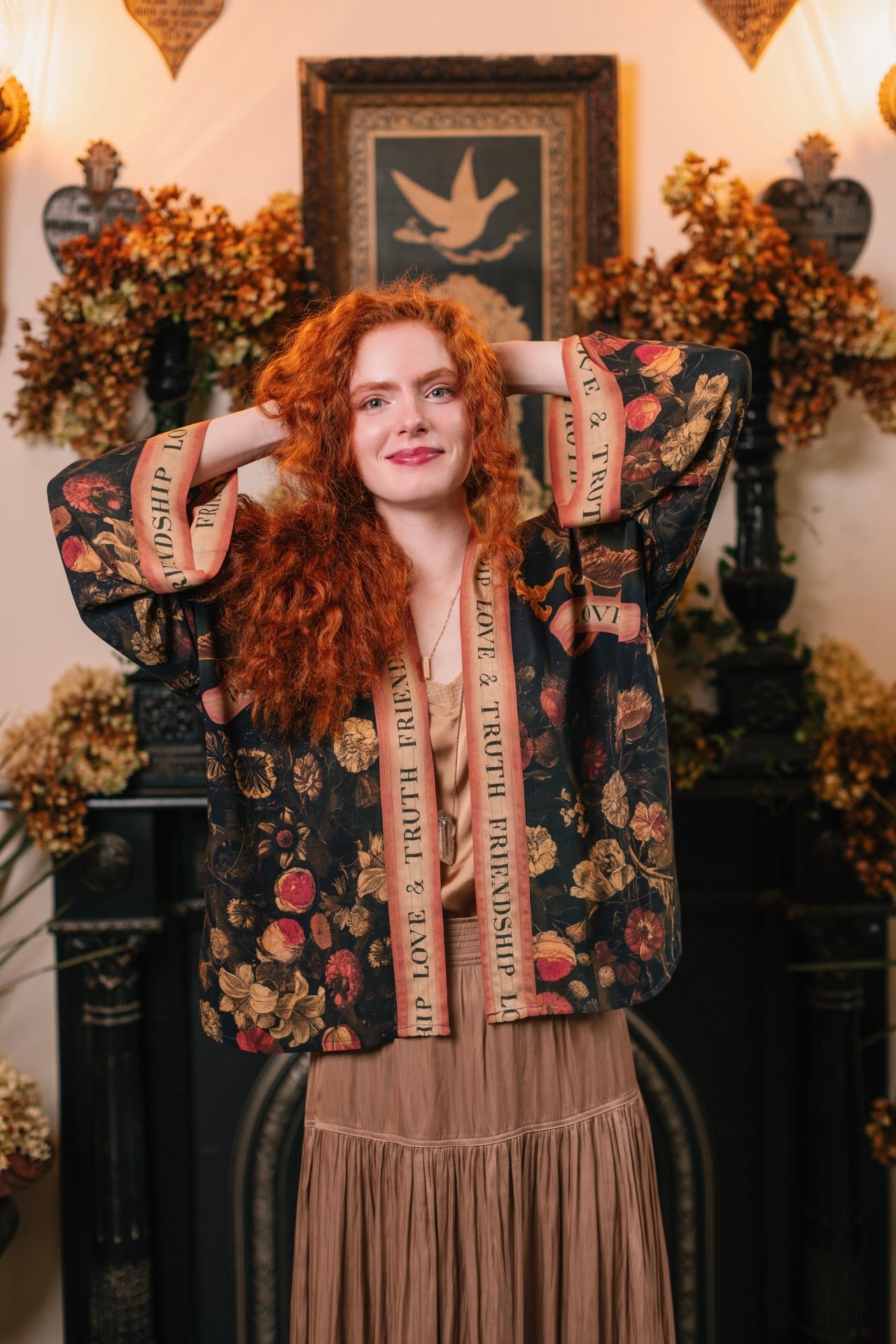Model wearing a cropped-length bamboo-viscose duster featuring a collage of antique artwork with romance, loyalty, and old-world beauty - Market of Stars