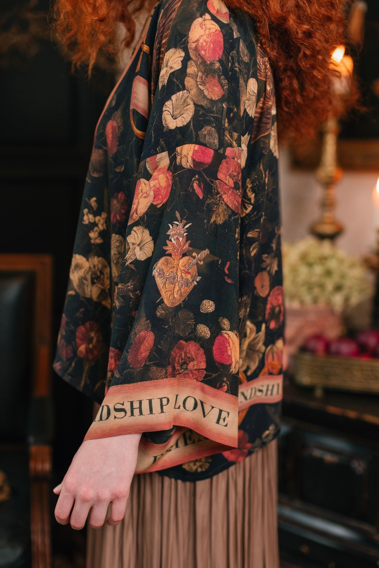 Model wearing a cropped-length bamboo-viscose duster featuring a collage of antique artwork with romance, loyalty, and old-world beauty - Market of Stars