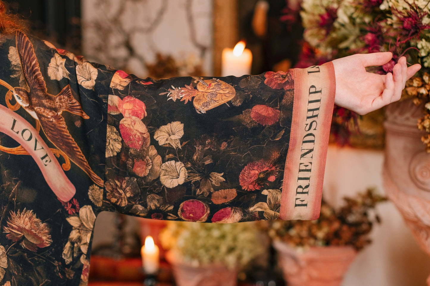Model wearing a cropped-length bamboo-viscose duster featuring a collage of antique artwork with romance, loyalty, and old-world beauty - Market of Stars