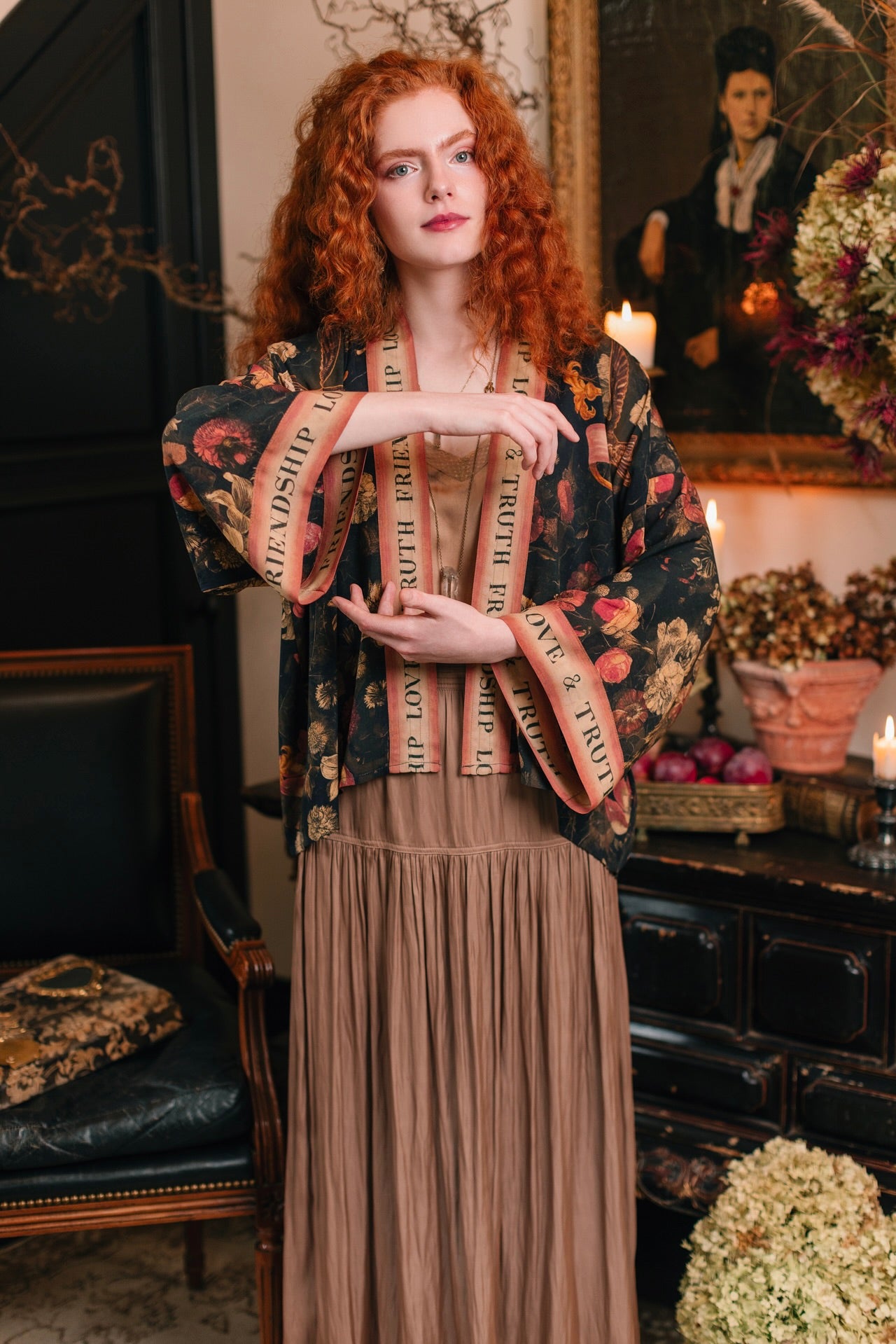 Model wearing a cropped-length bamboo-viscose duster featuring a collage of antique artwork with romance, loyalty, and old-world beauty - Market of Stars