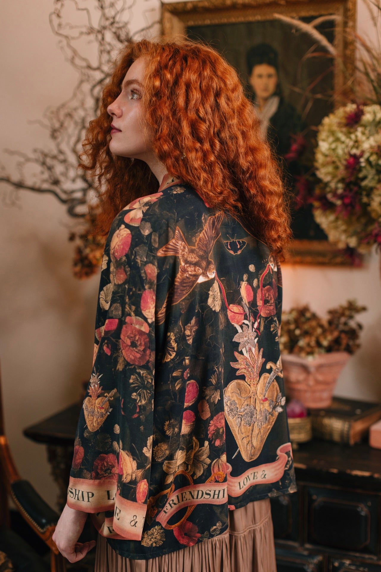 Model wearing a cropped-length bamboo-viscose duster featuring a collage of antique artwork with romance, loyalty, and old-world beauty - Market of Stars