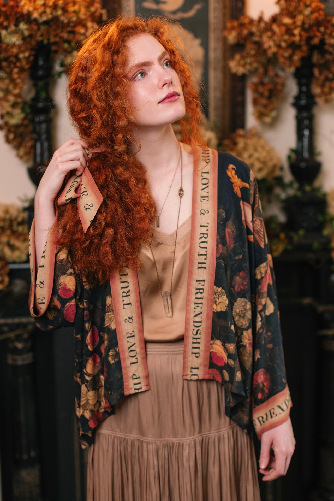 Model wearing a cropped-length bamboo-viscose duster featuring a collage of antique artwork with romance, loyalty, and old-world beauty - Market of Stars