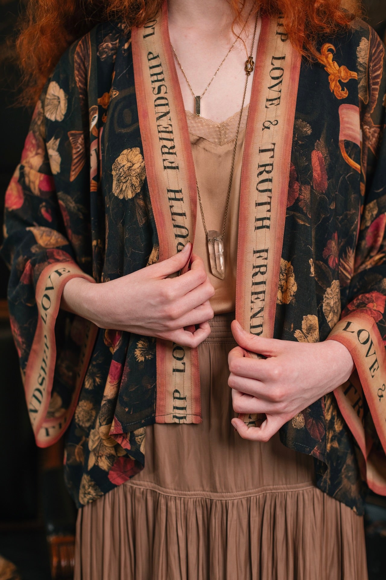 Model wearing a cropped-length bamboo-viscose duster featuring a collage of antique artwork with romance, loyalty, and old-world beauty - Market of Stars