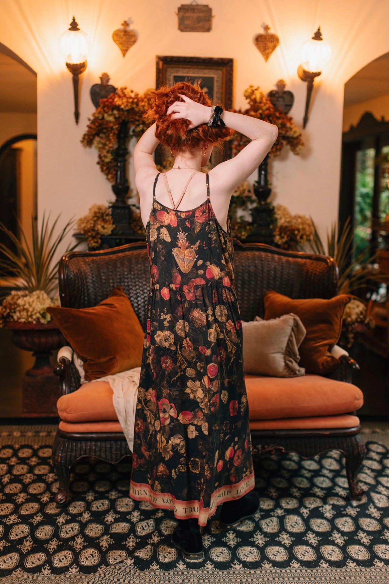 Model wearing a maxi-length bamboo-viscose slip dress featuring a collage of antique artwork with romance, loyalty, and old-world beauty - Market of Stars