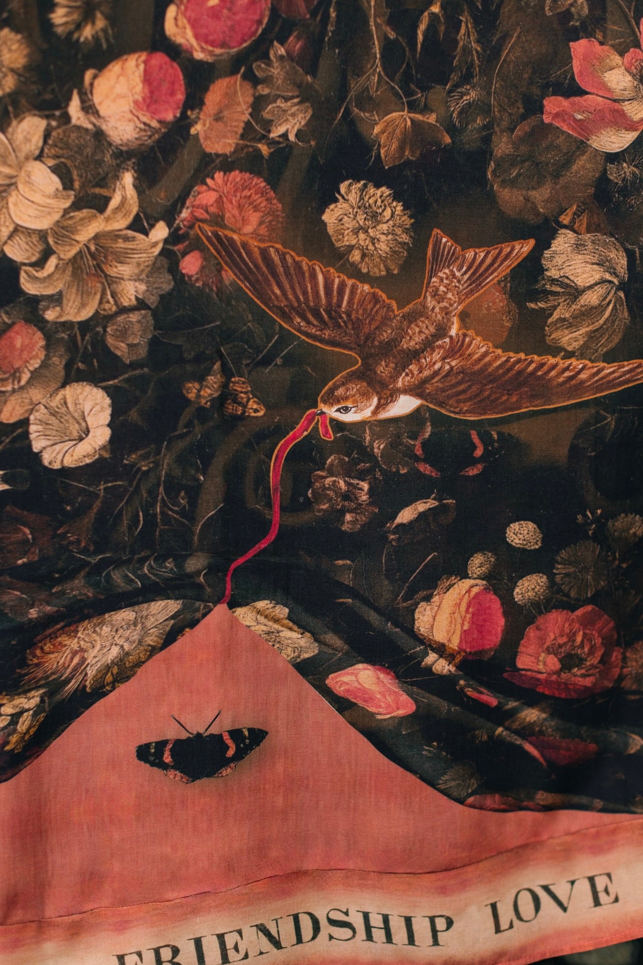 Model wearing a maxi-length bamboo-viscose slip dress featuring a collage of antique artwork with romance, loyalty, and old-world beauty - Market of Stars