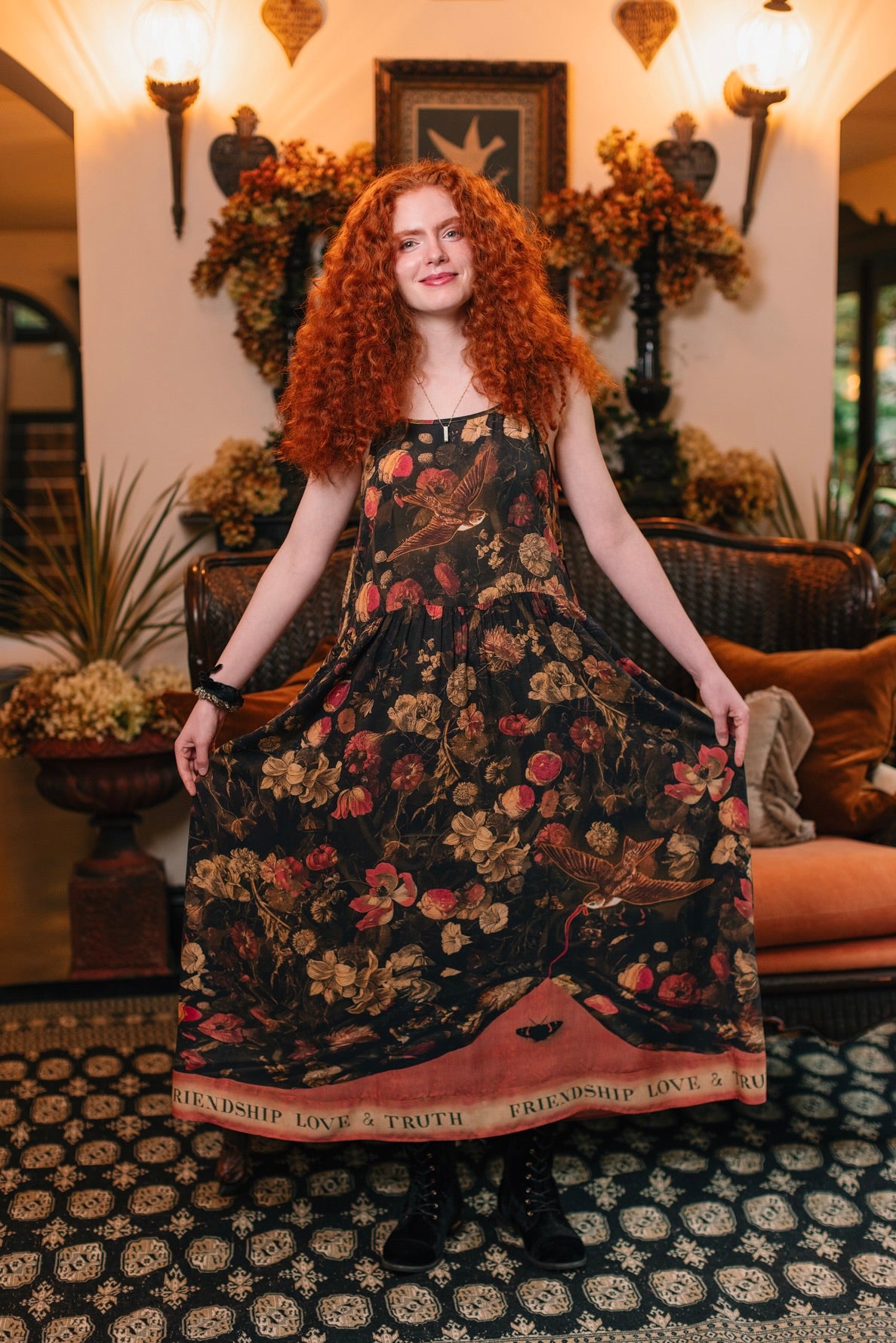 Model wearing a maxi-length bamboo-viscose slip dress featuring a collage of antique artwork with romance, loyalty, and old-world beauty - Market of Stars