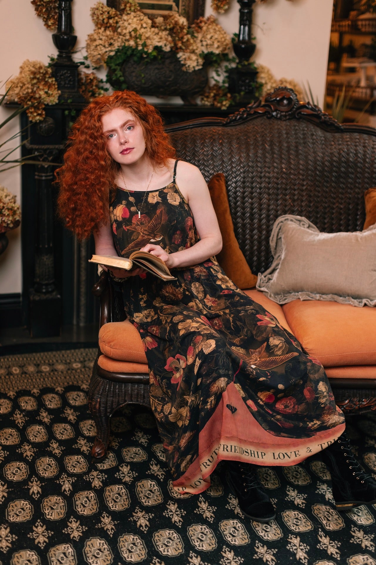 Model wearing a maxi-length bamboo-viscose slip dress featuring a collage of antique artwork with romance, loyalty, and old-world beauty - Market of Stars