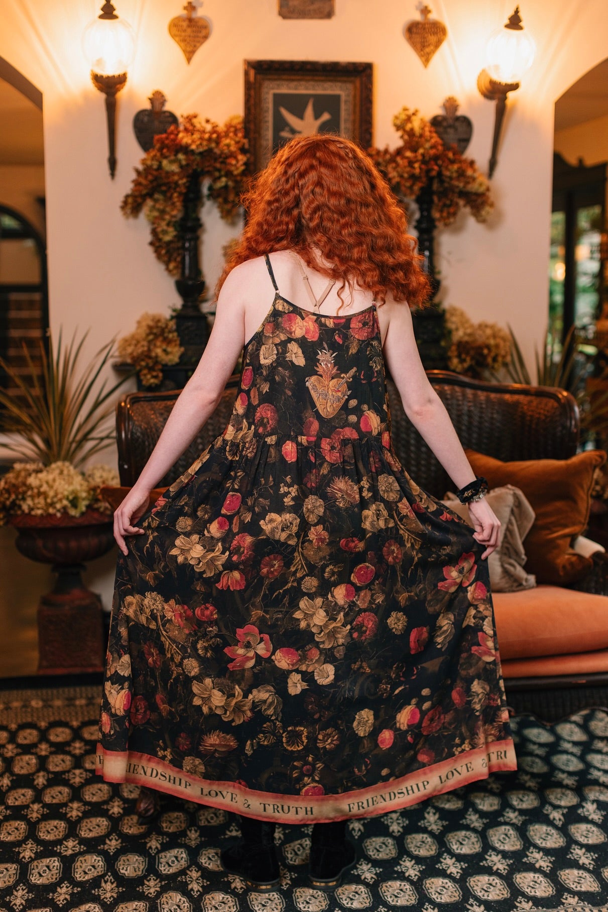 Model wearing a maxi-length bamboo-viscose slip dress featuring a collage of antique artwork with romance, loyalty, and old-world beauty - Market of Stars