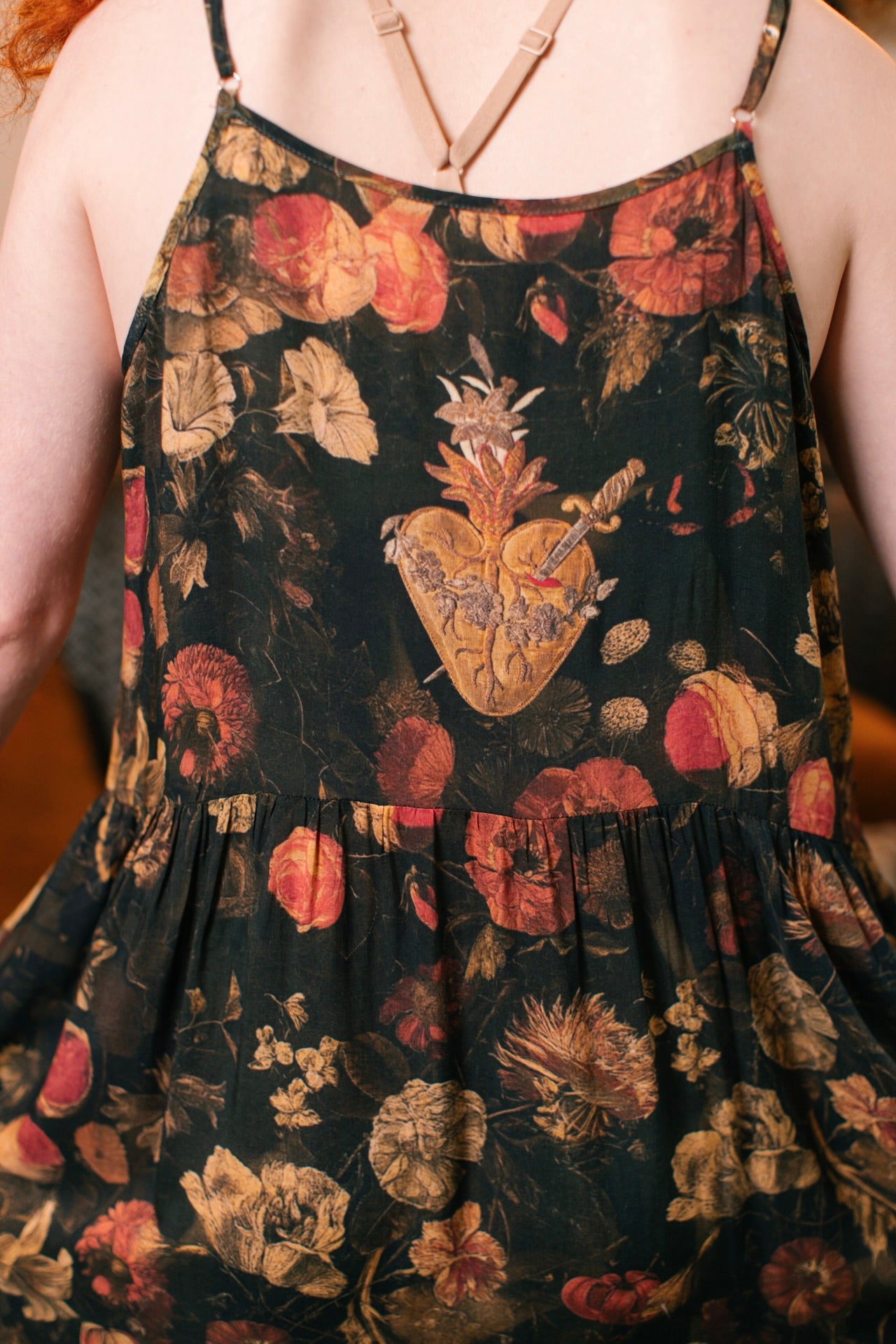 Model wearing a maxi-length bamboo-viscose slip dress featuring a collage of antique artwork with romance, loyalty, and old-world beauty - Market of Stars