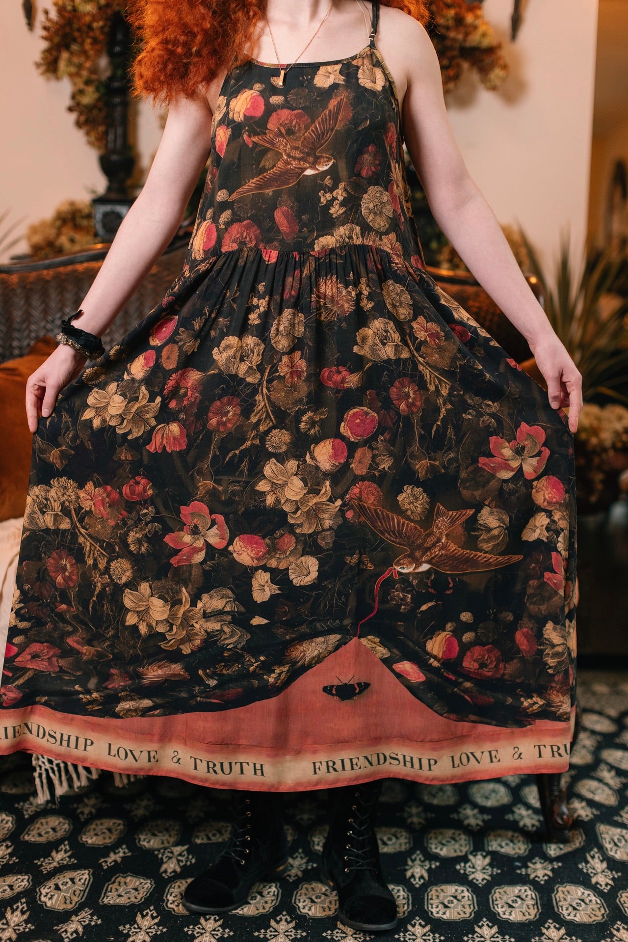 Model wearing a maxi-length bamboo-viscose slip dress featuring a collage of antique artwork with romance, loyalty, and old-world beauty - Market of Stars