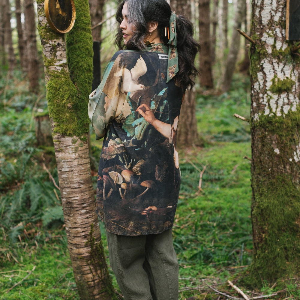 
                  
                    Model wearing the Heartwork Cropped Kimono featuring Artemisia Gentileschi’s self-portrait with lush forest, birds, and butterflies – Market of Stars.
                  
                