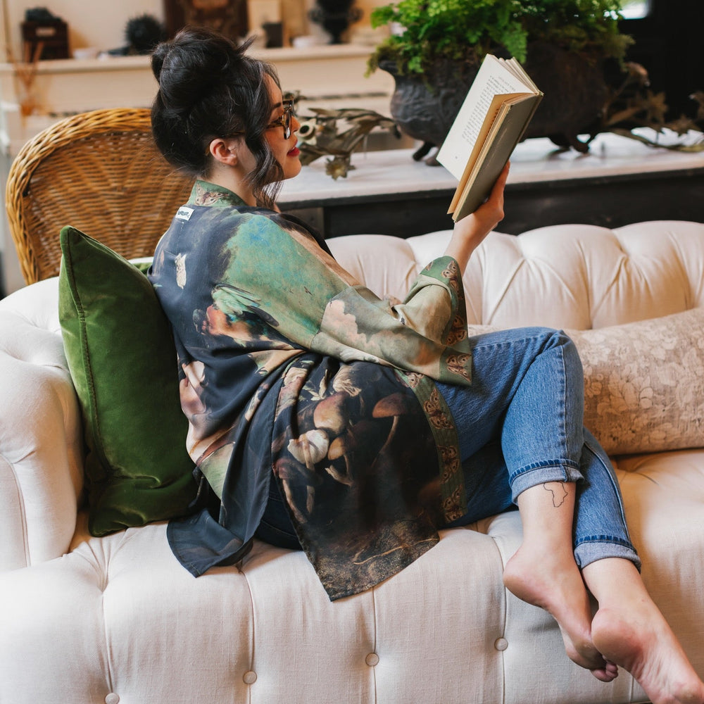 
                  
                    Model wearing the Heartwork Cropped Kimono featuring Artemisia Gentileschi’s self-portrait with lush forest, birds, and butterflies – Market of Stars.
                  
                