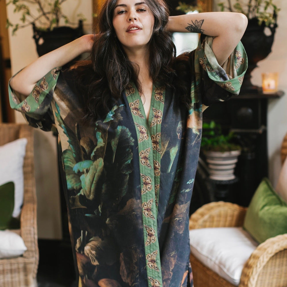 
                  
                    Model wearing the Heartwork Opera Duster featuring Artemisia Gentileschi’s self-portrait surrounded by forest, birds, and butterflies – Market of Stars.
                  
                