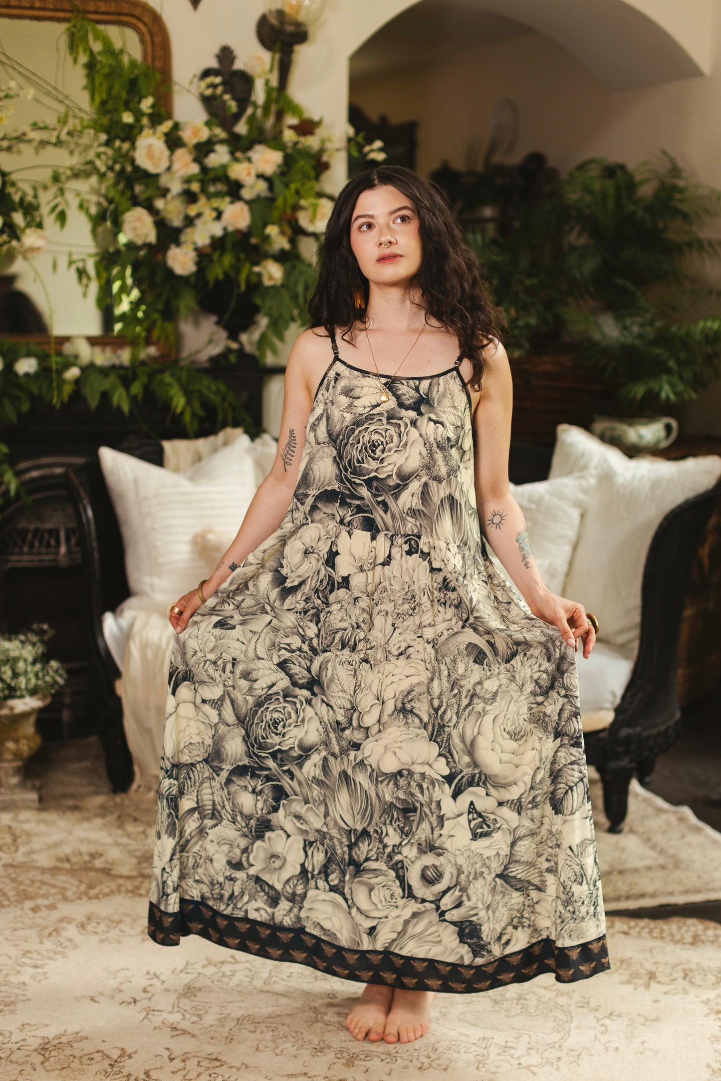 Model wearing a maxi-length slip dress featuring black-and-ivory floral lithographs from the 1900's - Market of Stars