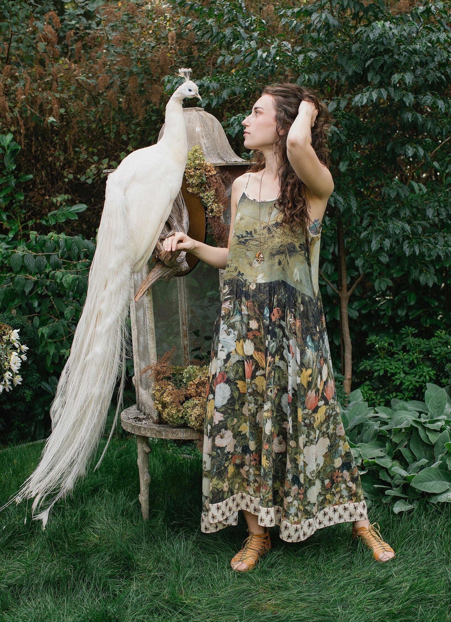 Model wearing the I Dream in Flowers Bohéme Slip Dress with vintage-inspired floral artwork and Victorian bumblebee details, perfect for layering or lounging – Market of Stars.