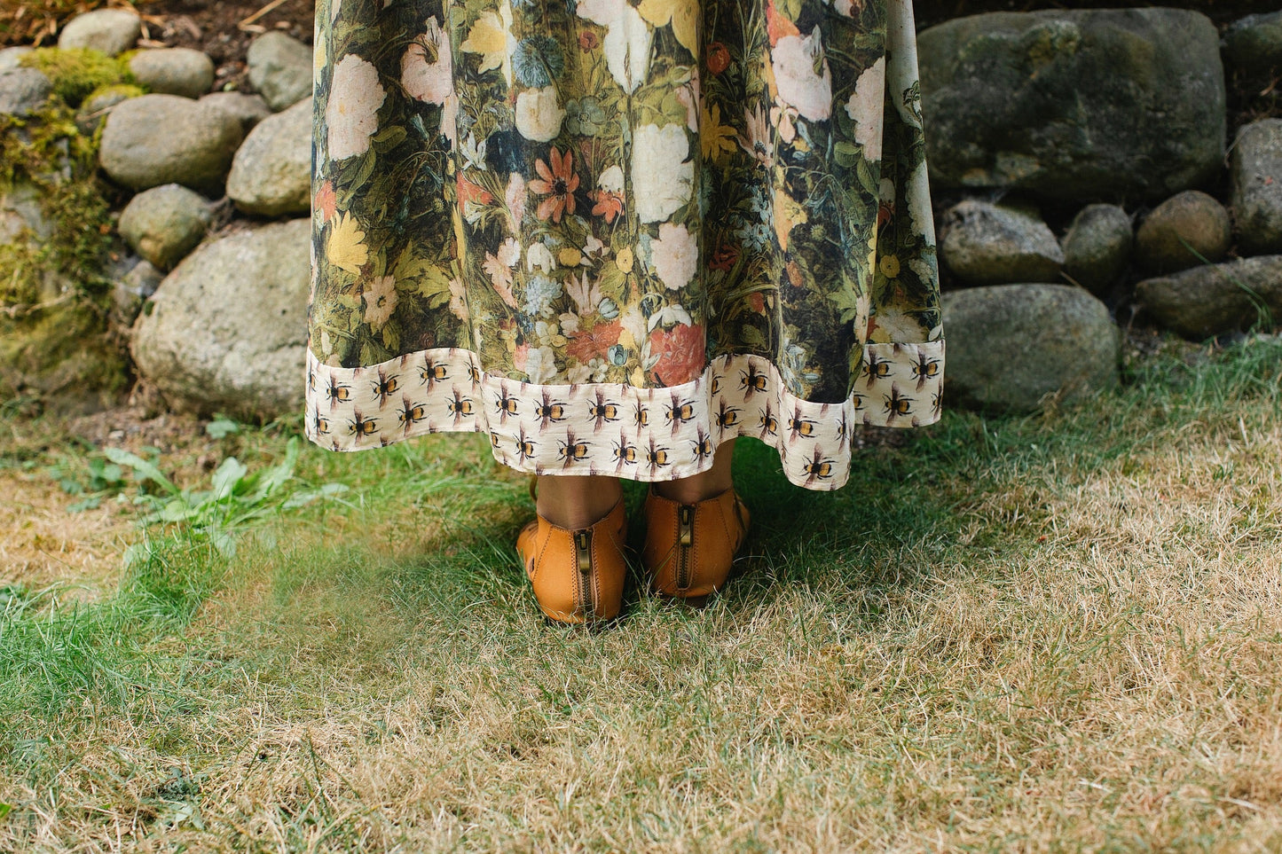 Model wearing the I Dream in Flowers Bohéme Slip Dress with vintage-inspired floral artwork and Victorian bumblebee details, perfect for layering or lounging – Market of Stars.