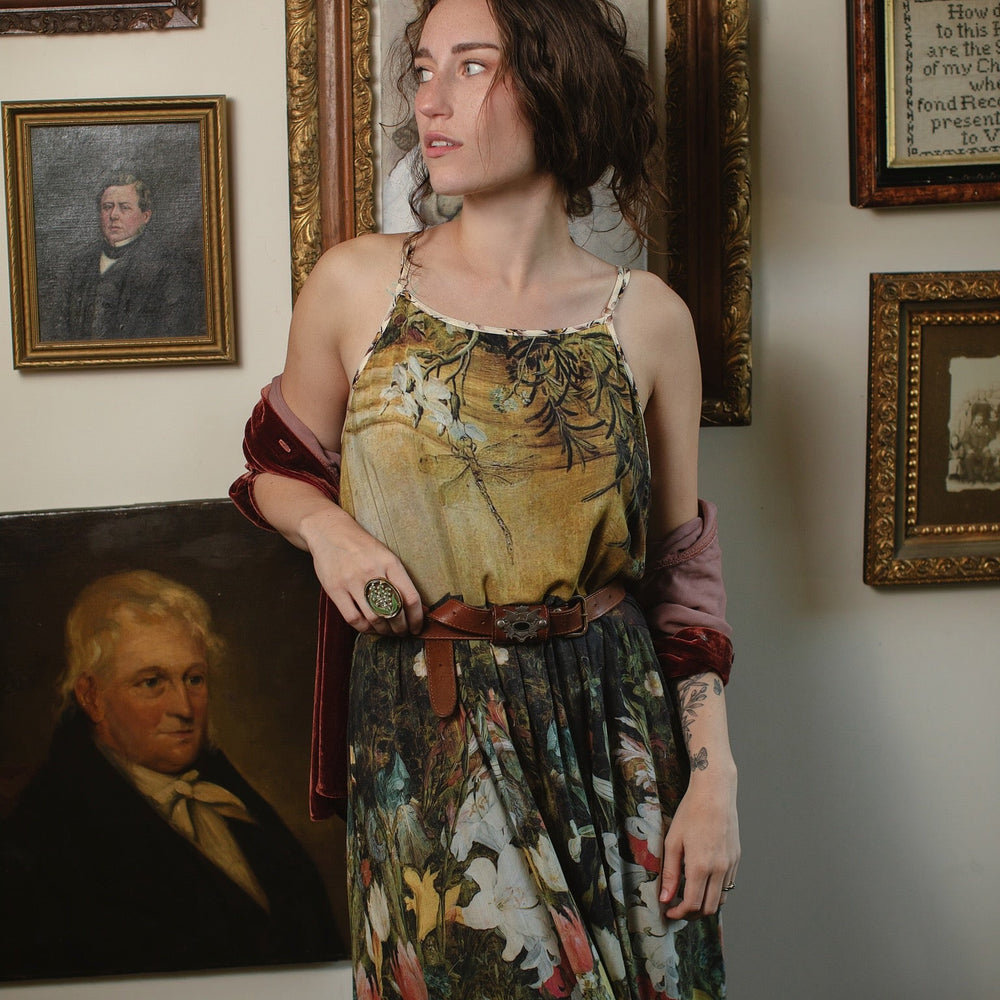 
                  
                    Model wearing the I Dream in Flowers Bohéme Slip Dress with vintage-inspired floral artwork and Victorian bumblebee details, perfect for layering or lounging – Market of Stars.
                  
                