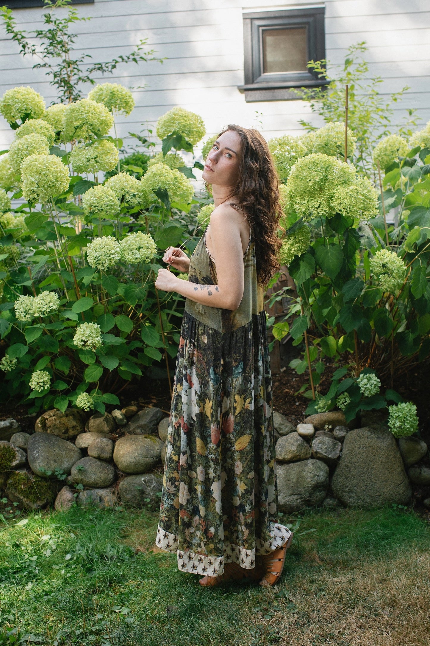 Model wearing the I Dream in Flowers Bohéme Slip Dress with vintage-inspired floral artwork and Victorian bumblebee details, perfect for layering or lounging – Market of Stars.