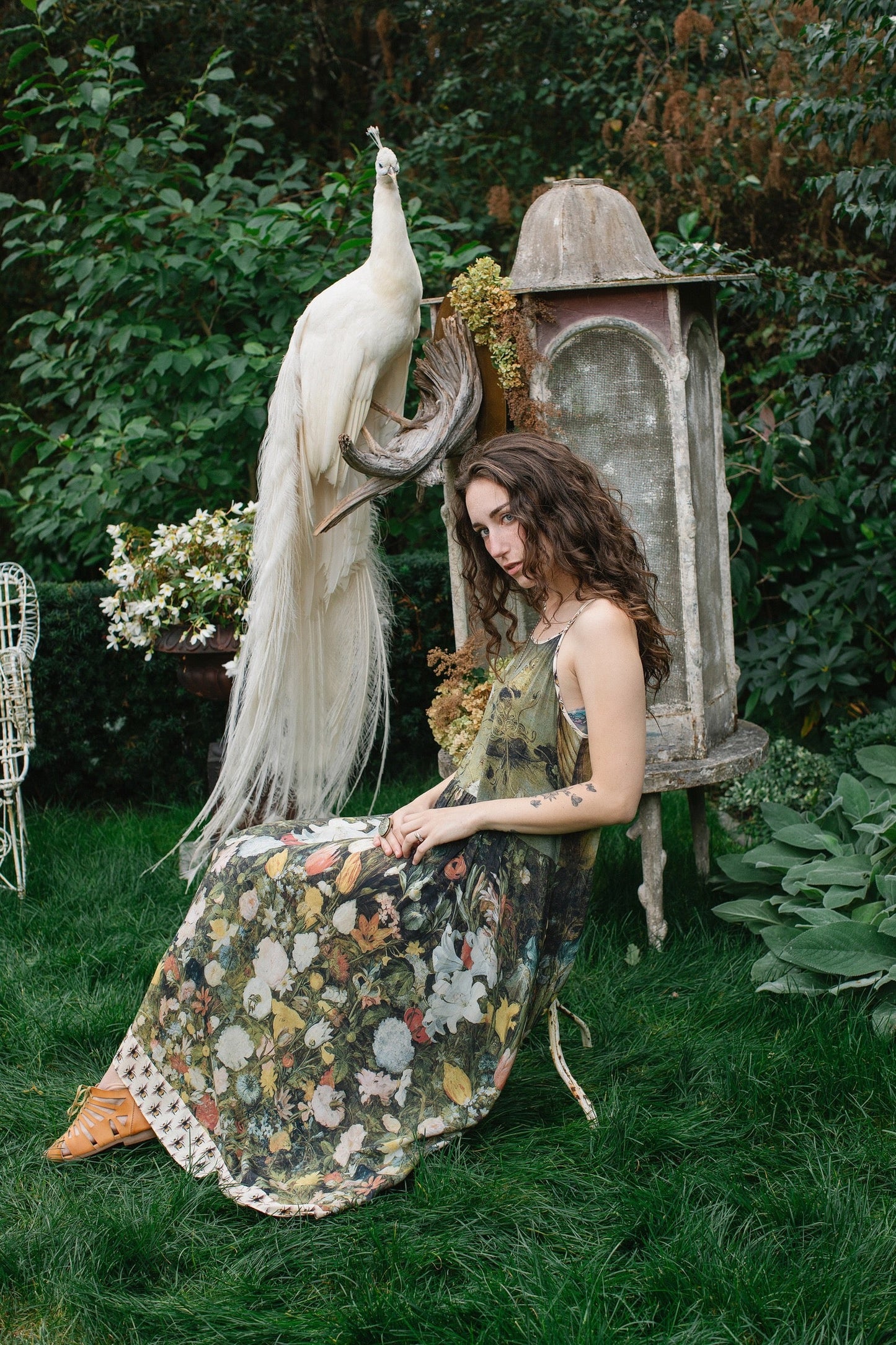 Model wearing the I Dream in Flowers Bohéme Slip Dress with vintage-inspired floral artwork and Victorian bumblebee details, perfect for layering or lounging – Market of Stars.
