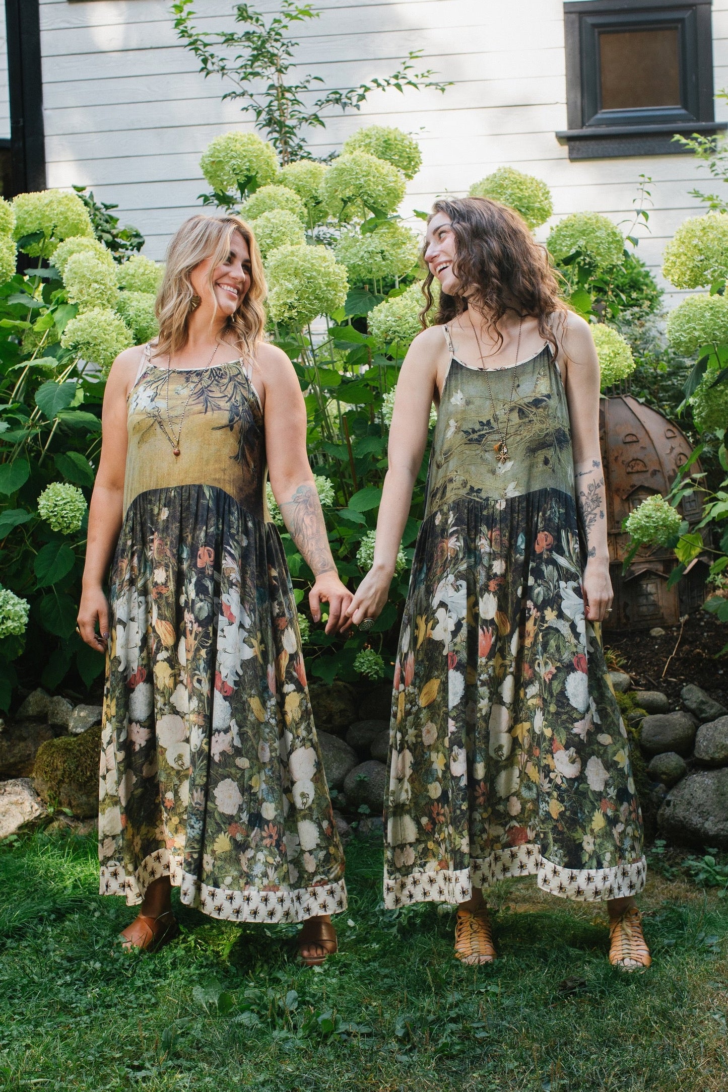 Model wearing the I Dream in Flowers Bohéme Slip Dress with vintage-inspired floral artwork and Victorian bumblebee details, perfect for layering or lounging – Market of Stars.