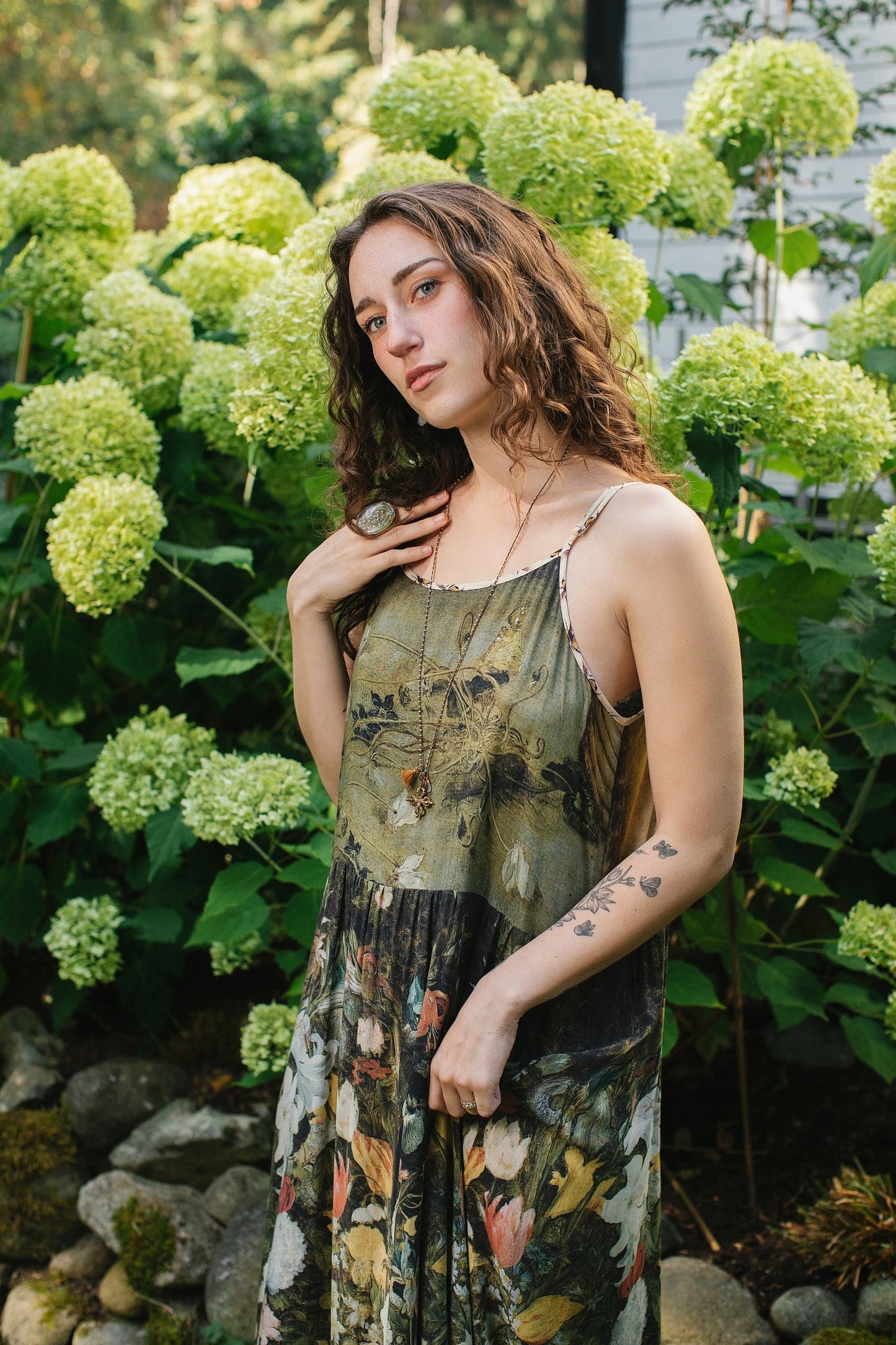 Model wearing the I Dream in Flowers Bohéme Slip Dress with vintage-inspired floral artwork and Victorian bumblebee details, perfect for layering or lounging – Market of Stars.