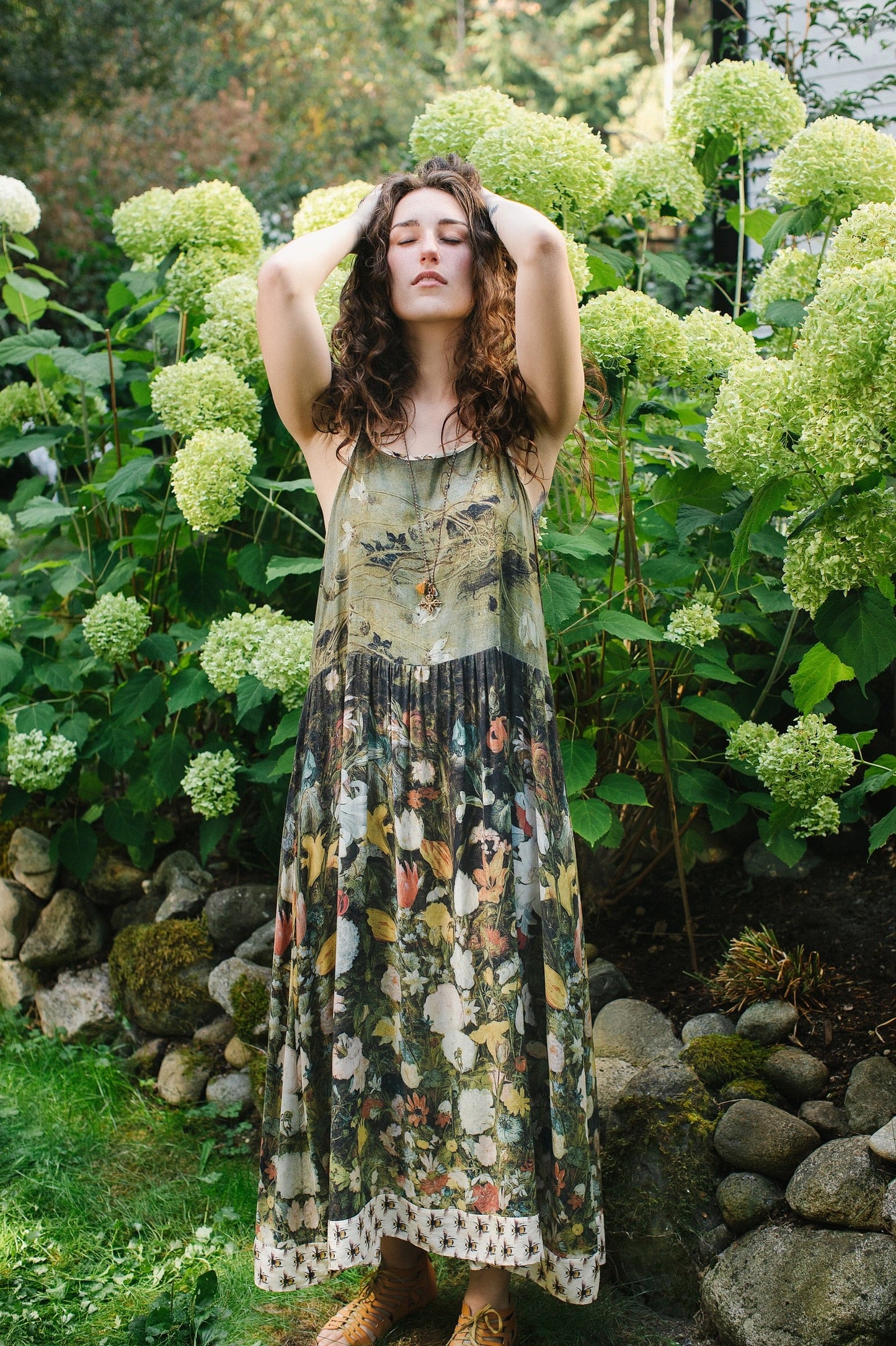 Model wearing the I Dream in Flowers Bohéme Slip Dress with vintage-inspired floral artwork and Victorian bumblebee details, perfect for layering or lounging – Market of Stars.