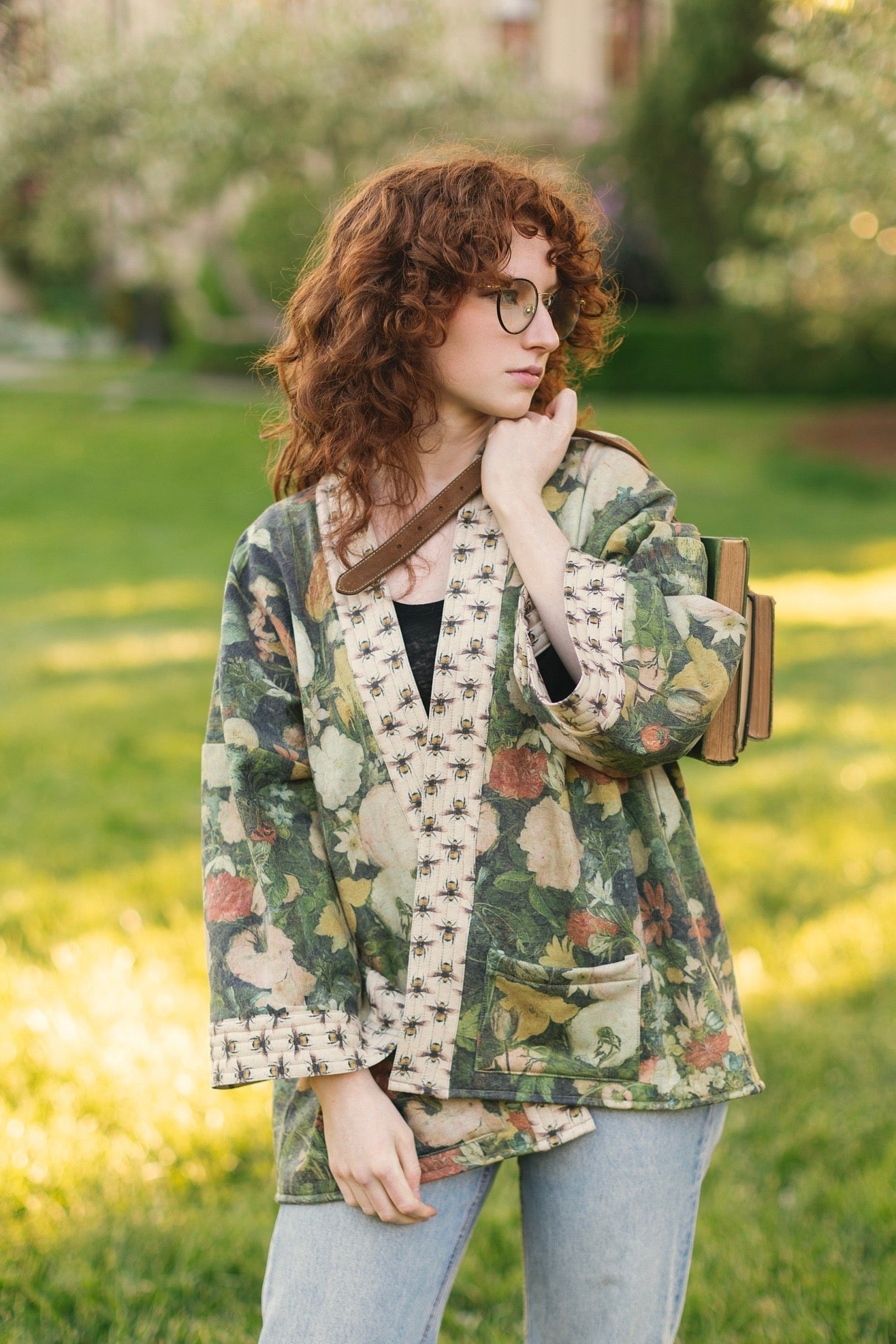 Model wearing the I Dream in Flowers Cottage Cardigan featuring painterly floral artwork and Victorian bumblebee trim, perfect for cozy layering – Market of Stars