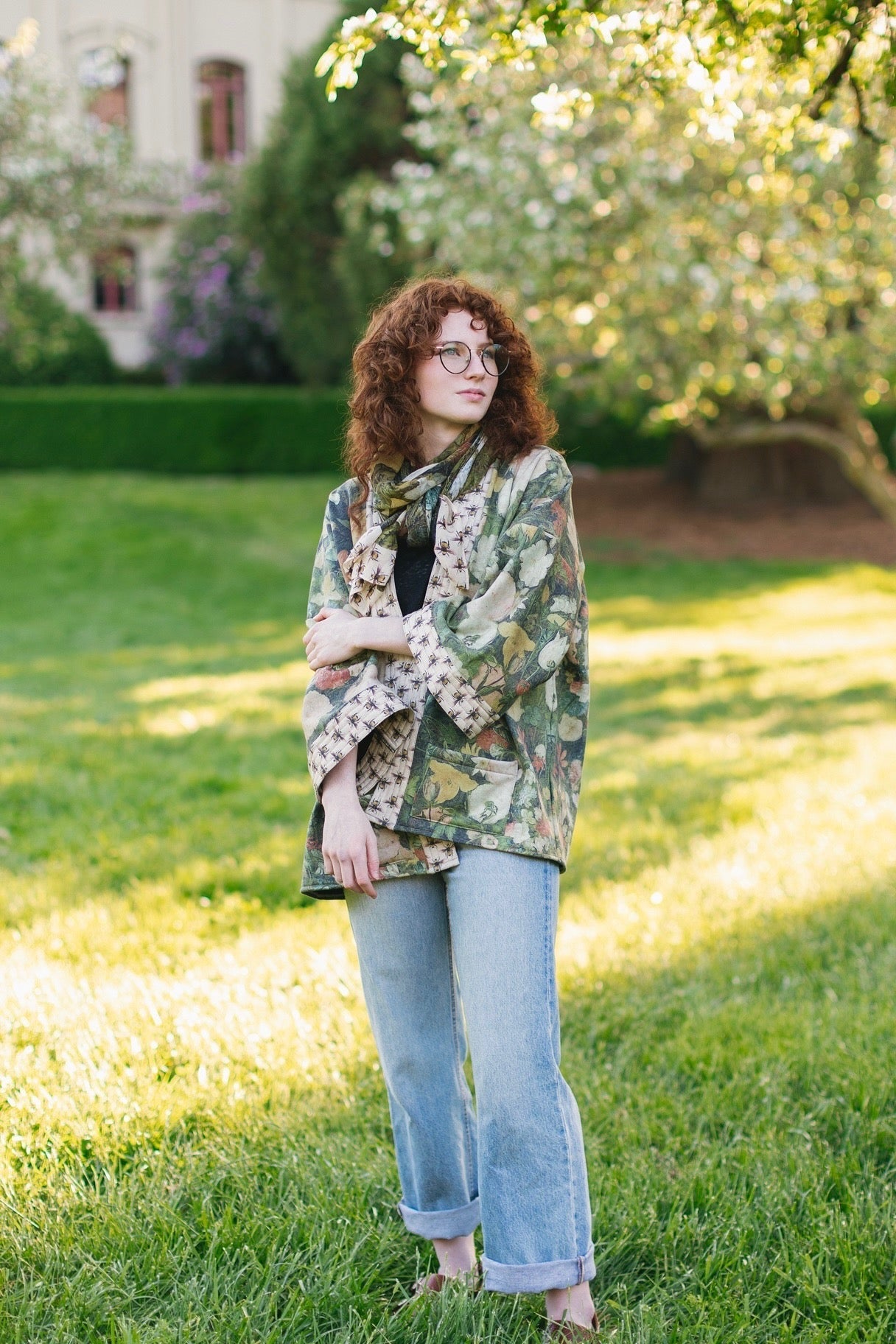 Model wearing the I Dream in Flowers Cottage Cardigan featuring painterly floral artwork and Victorian bumblebee trim, perfect for cozy layering – Market of Stars