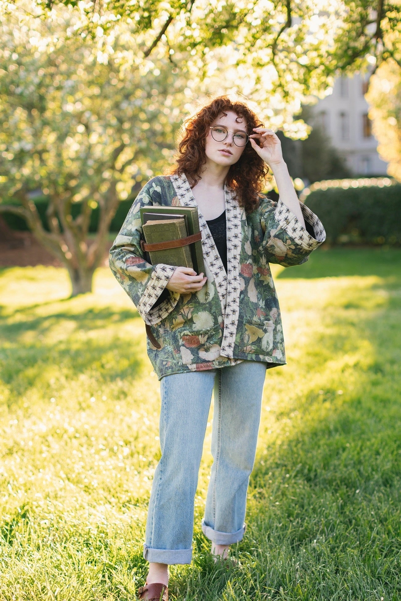 Model wearing the I Dream in Flowers Cottage Cardigan featuring painterly floral artwork and Victorian bumblebee trim, perfect for cozy layering – Market of Stars