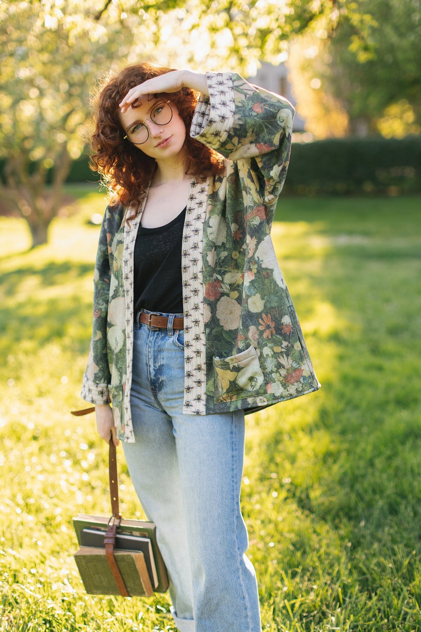 Model wearing the I Dream in Flowers Cottage Cardigan featuring painterly floral artwork and Victorian bumblebee trim, perfect for cozy layering – Market of Stars