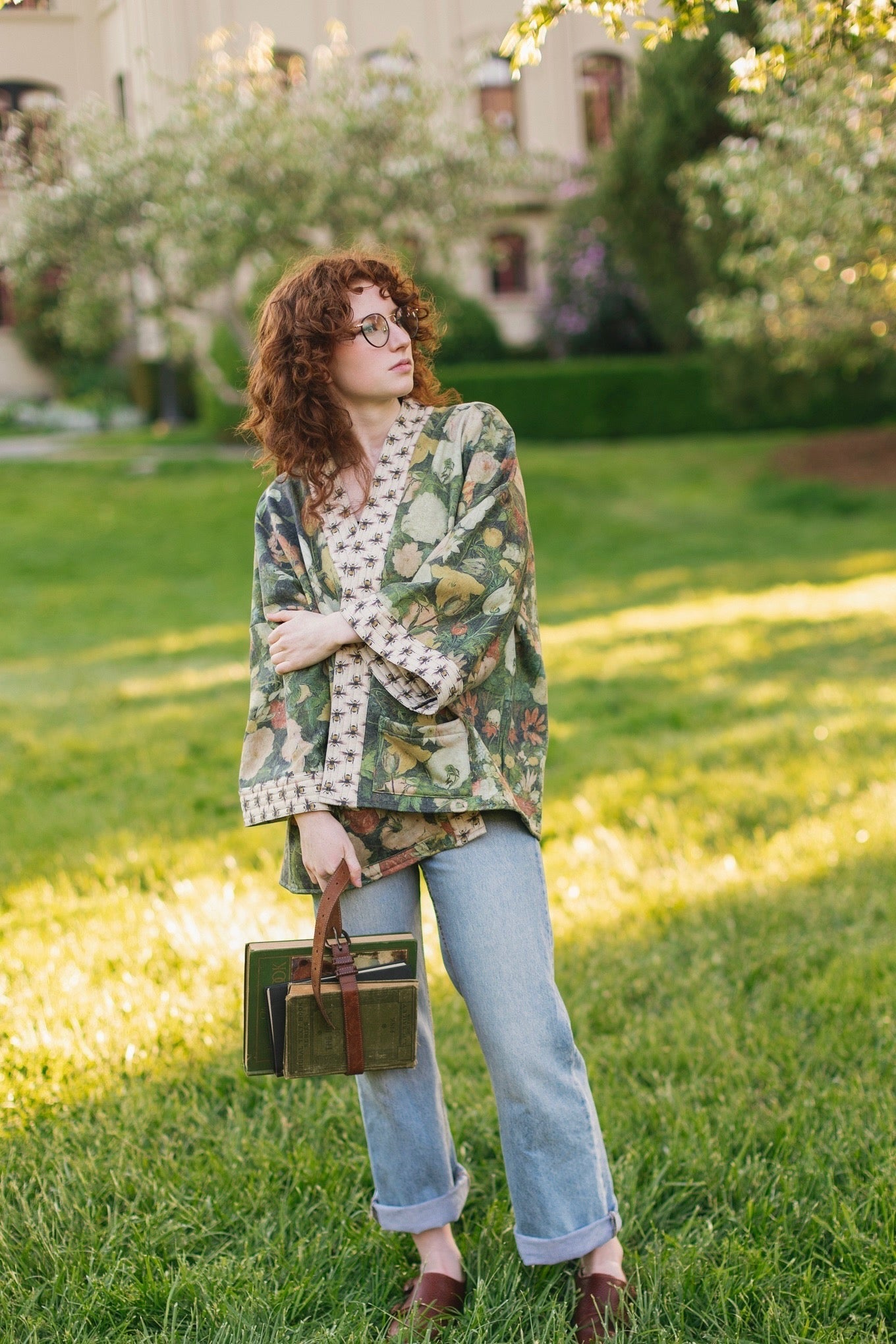 Model wearing the I Dream in Flowers Cottage Cardigan featuring painterly floral artwork and Victorian bumblebee trim, perfect for cozy layering – Market of Stars