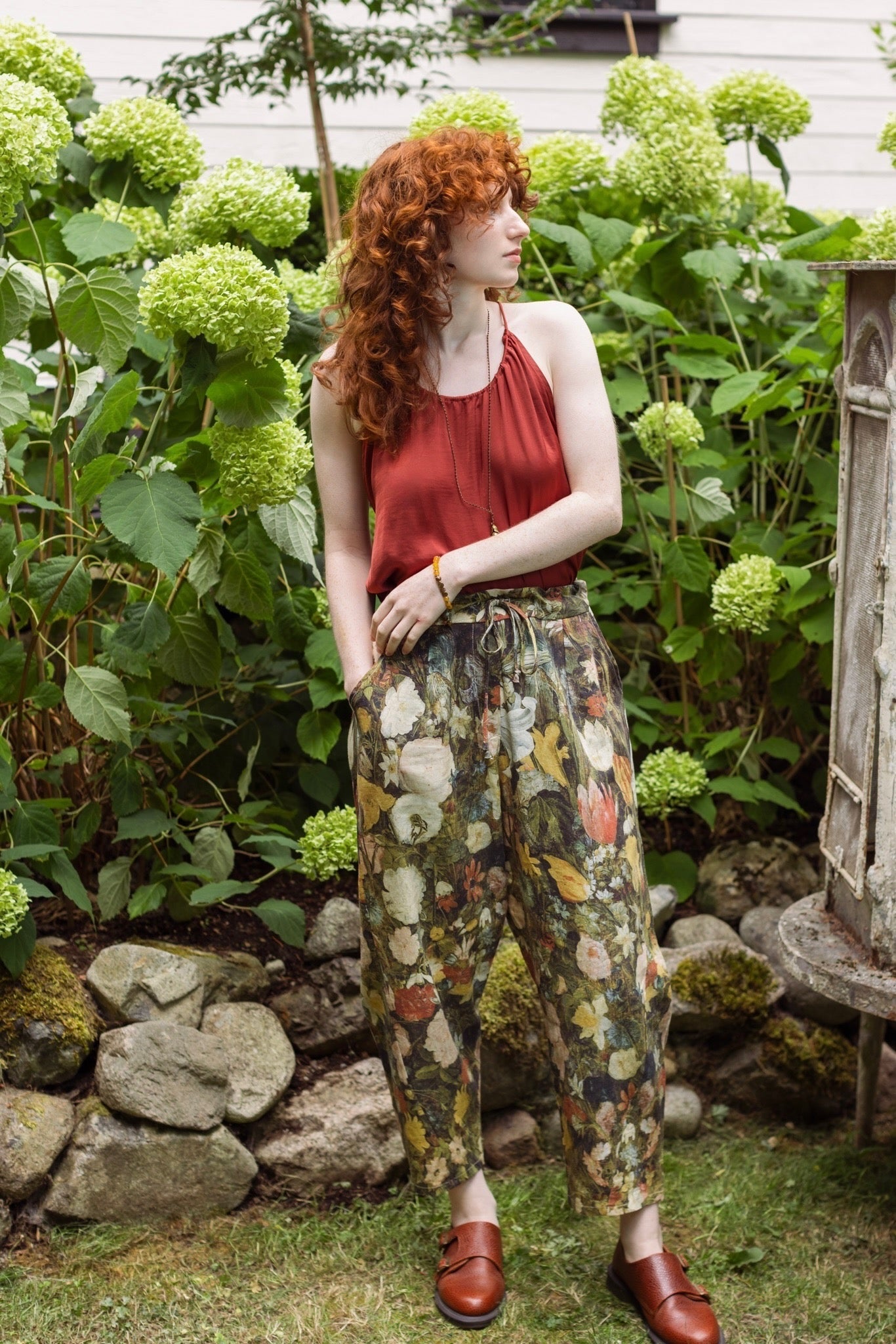 Model wearing the I Dream in Flowers Artist Pants featuring romantic floral artwork by Jan Brueghel and Victorian bumblebee trim, styled for everyday ease – Market of Stars