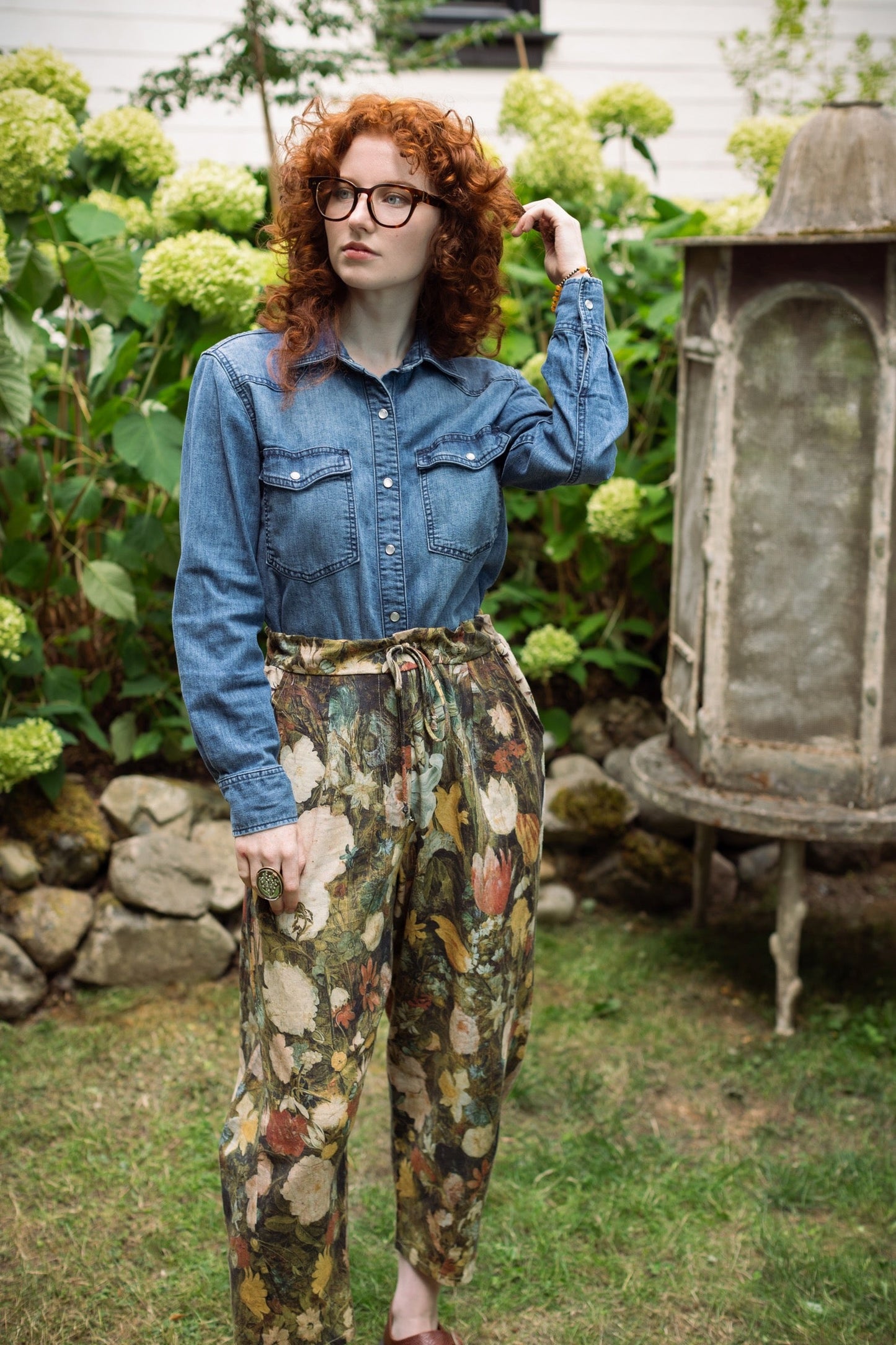 Model wearing the I Dream in Flowers Artist Pants featuring romantic floral artwork by Jan Brueghel and Victorian bumblebee trim, styled for everyday ease – Market of Stars