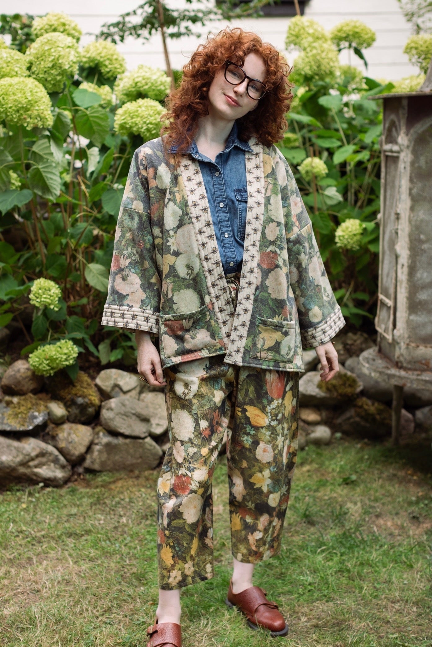 Model wearing the I Dream in Flowers Artist Pants featuring romantic floral artwork by Jan Brueghel and Victorian bumblebee trim, styled for everyday ease – Market of Stars