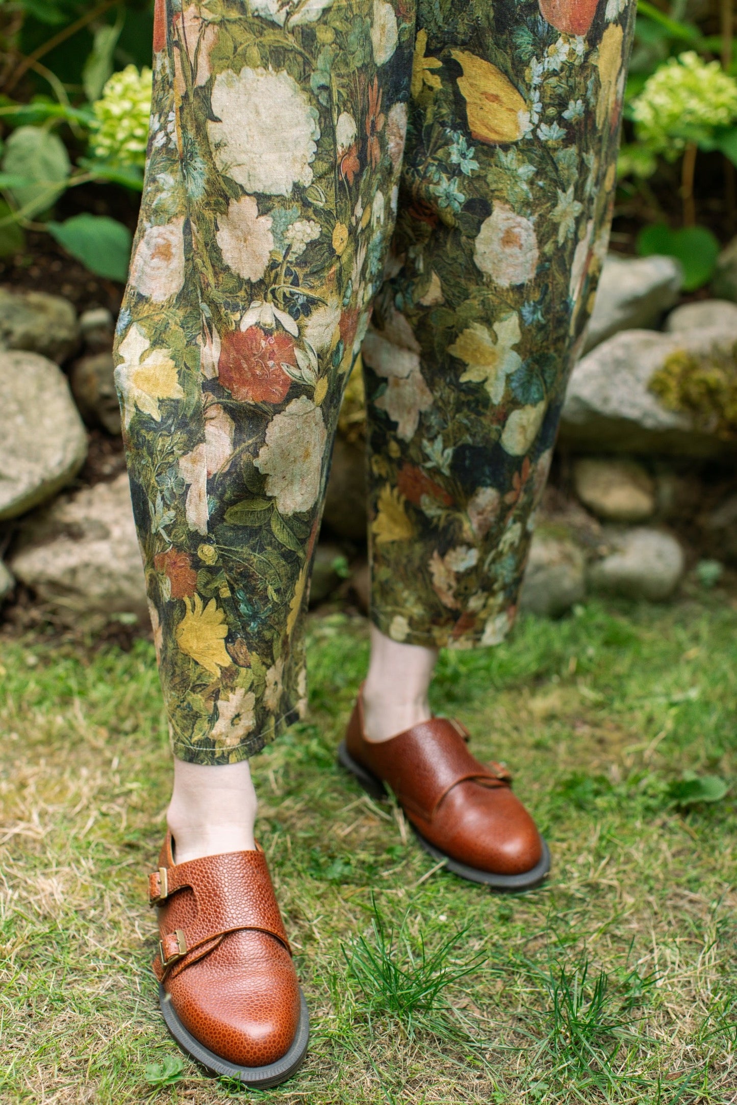 Model wearing the I Dream in Flowers Artist Pants featuring romantic floral artwork by Jan Brueghel and Victorian bumblebee trim, styled for everyday ease – Market of Stars