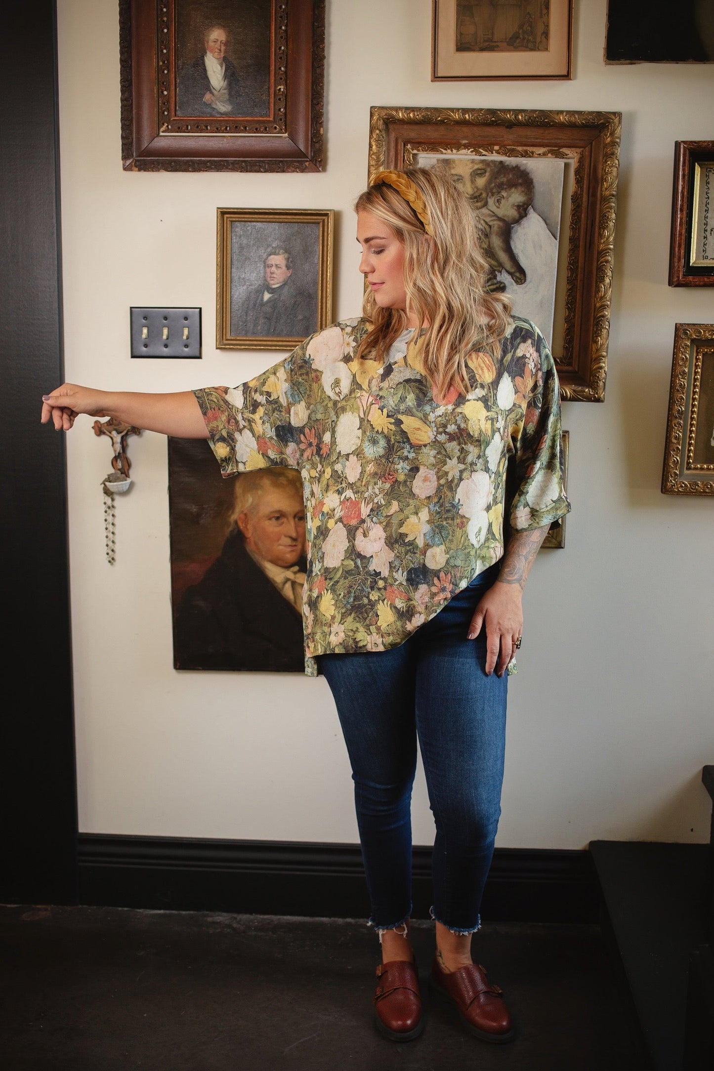 Model wearing the I Dream in Flowers Luxe Tee featuring painterly florals by Jan Brueghel and hidden bumblebee trim – Market of Stars.