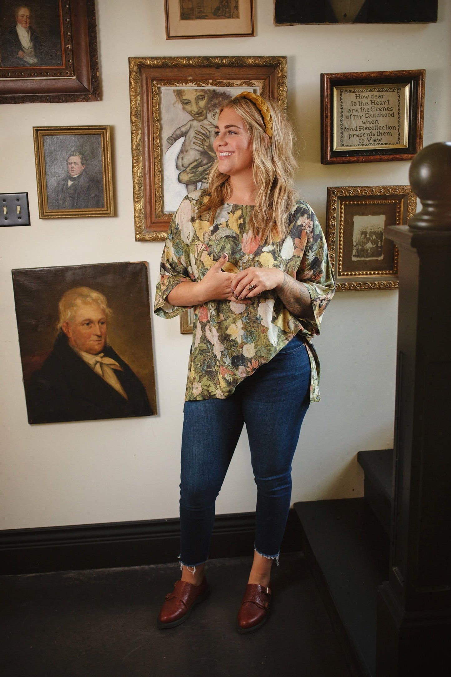 Model wearing the I Dream in Flowers Luxe Tee featuring painterly florals by Jan Brueghel and hidden bumblebee trim – Market of Stars.