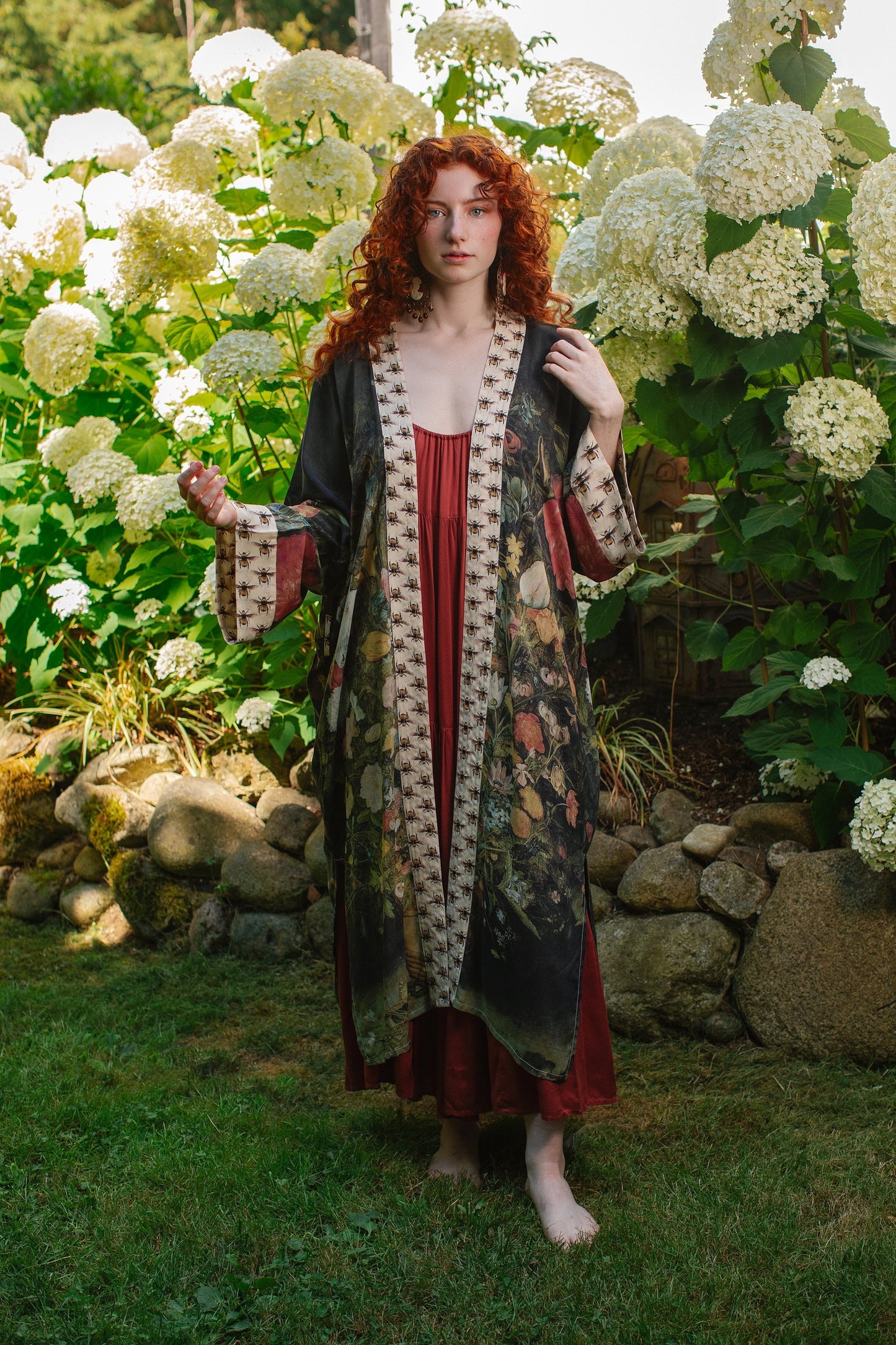 Model wearing the I Dream in Flowers Opera Duster featuring floral oil painting by Jan Brueghel and Victorian bumblebee trim – Market of Stars.