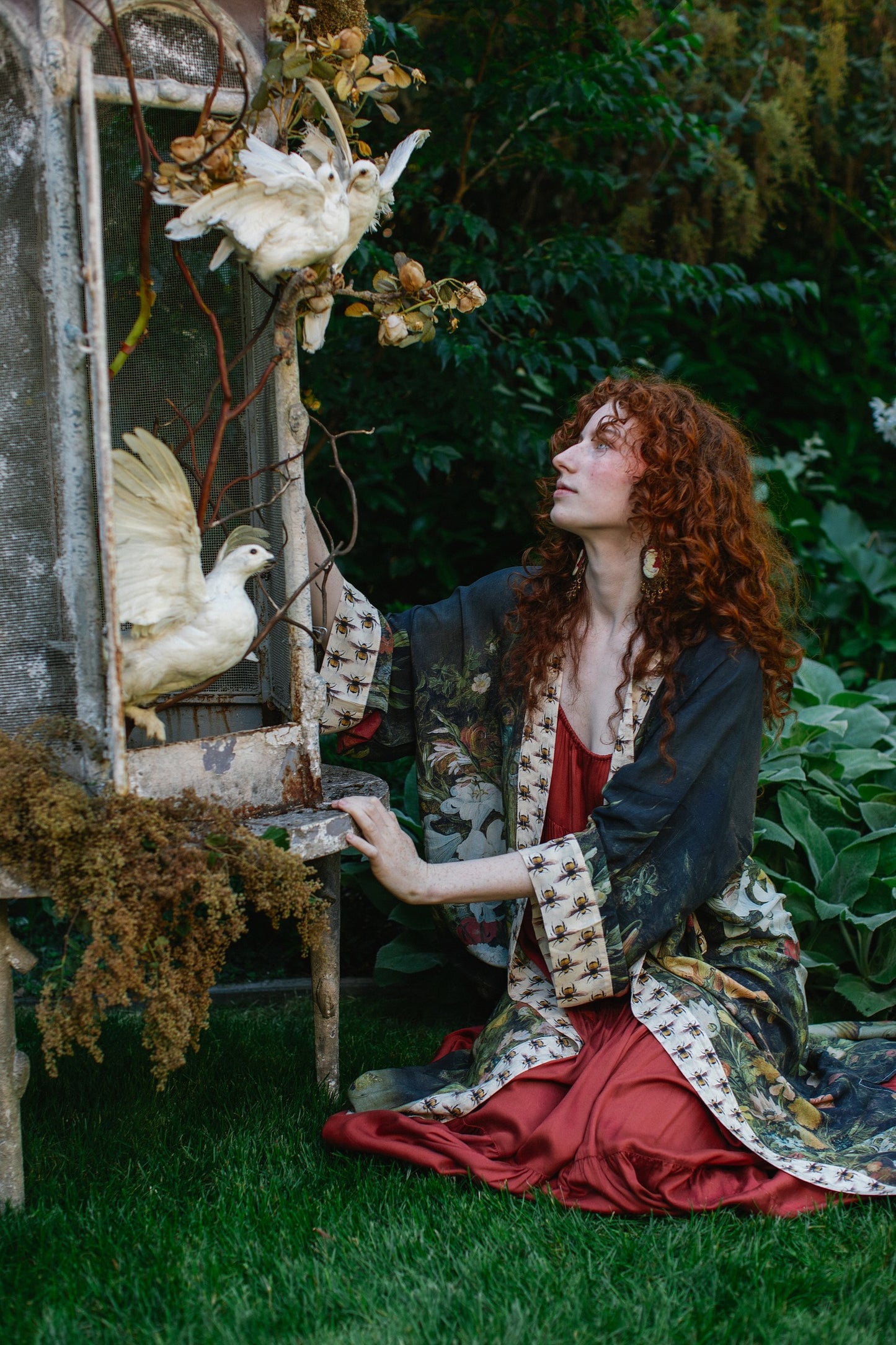 Model wearing the I Dream in Flowers Opera Duster featuring floral oil painting by Jan Brueghel and Victorian bumblebee trim – Market of Stars.