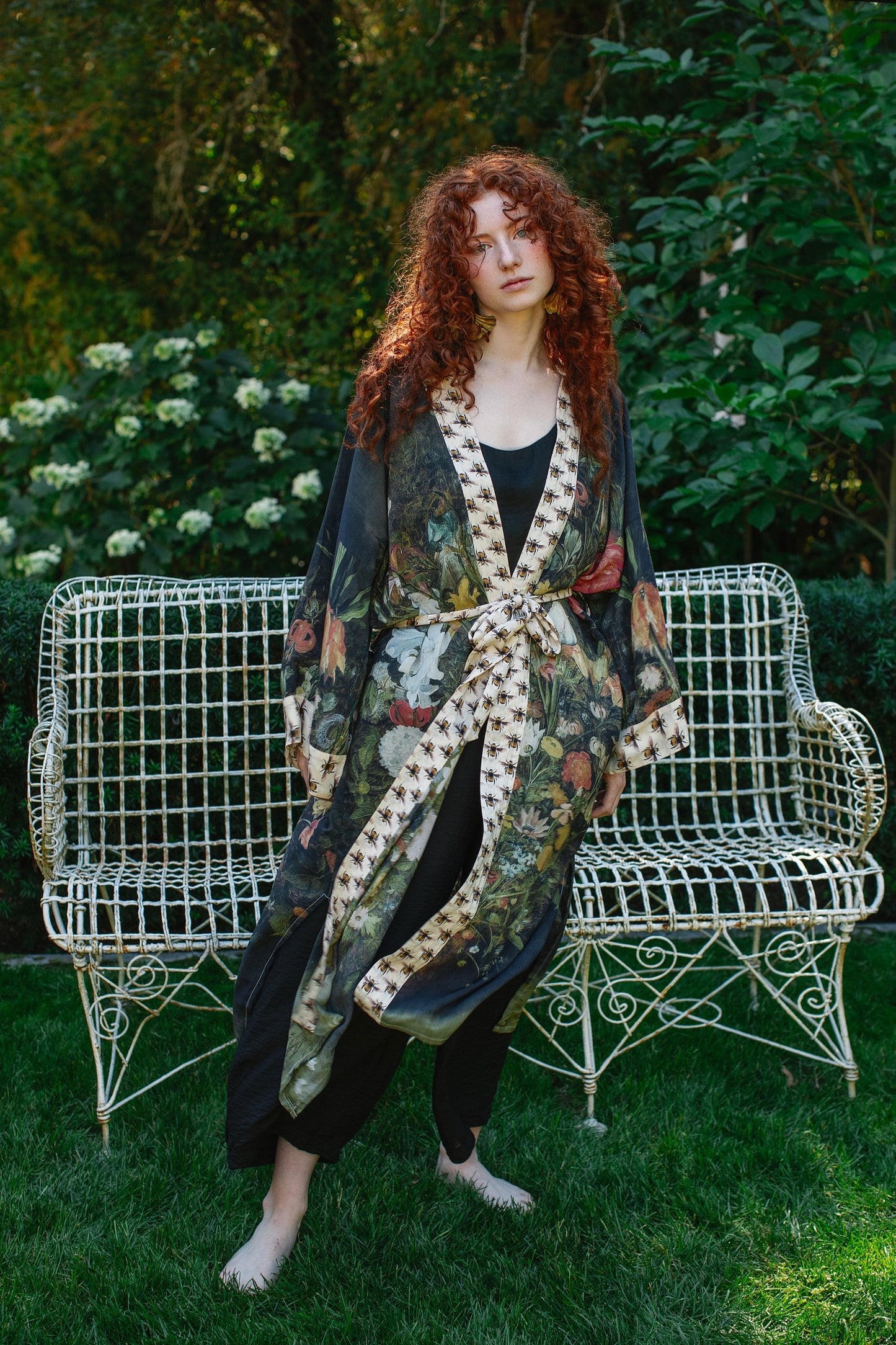 Model wearing the I Dream in Flowers Opera Duster featuring floral oil painting by Jan Brueghel and Victorian bumblebee trim – Market of Stars.