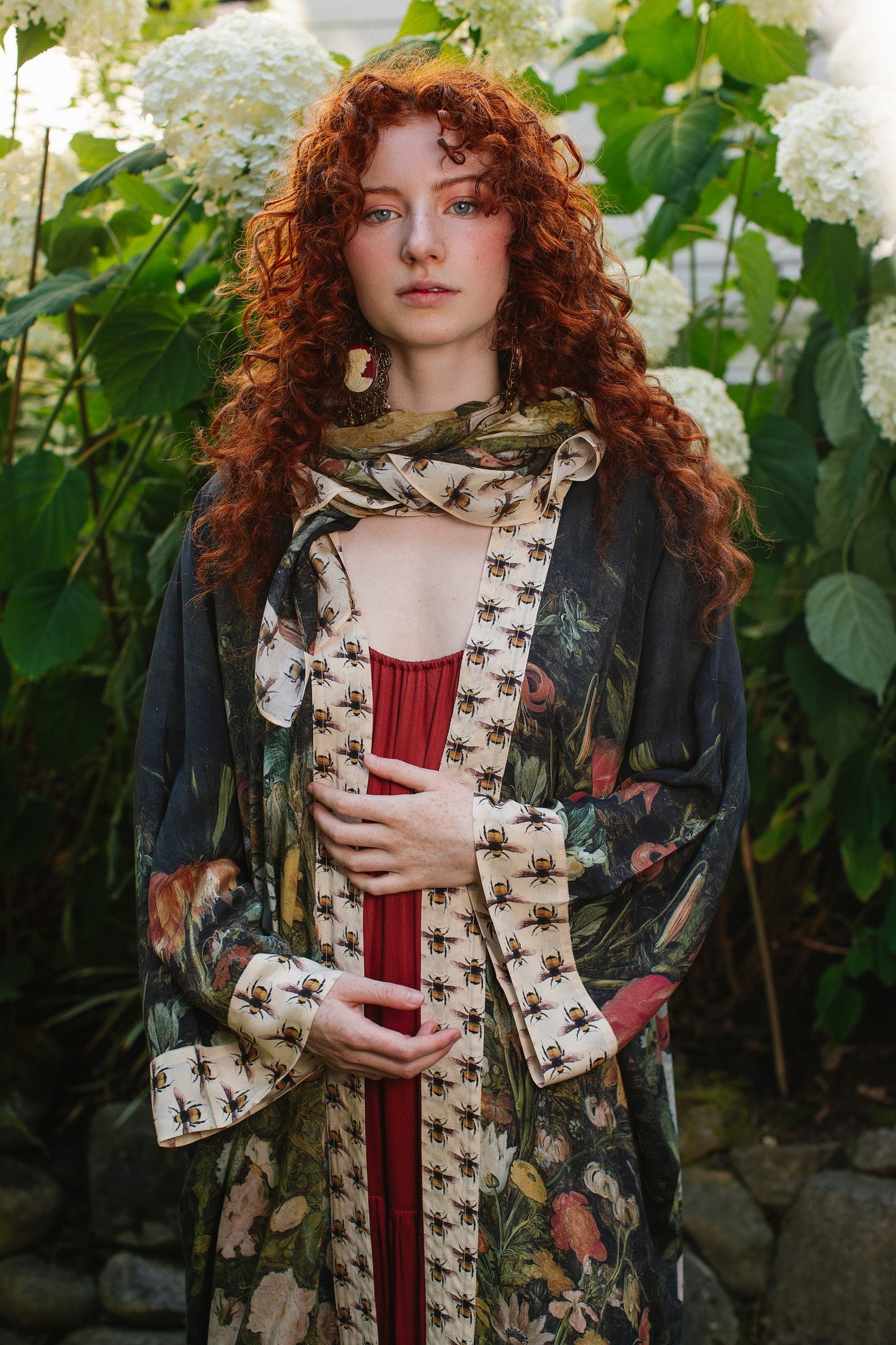 Model wearing the I Dream in Flowers Opera Duster featuring floral oil painting by Jan Brueghel and Victorian bumblebee trim – Market of Stars.