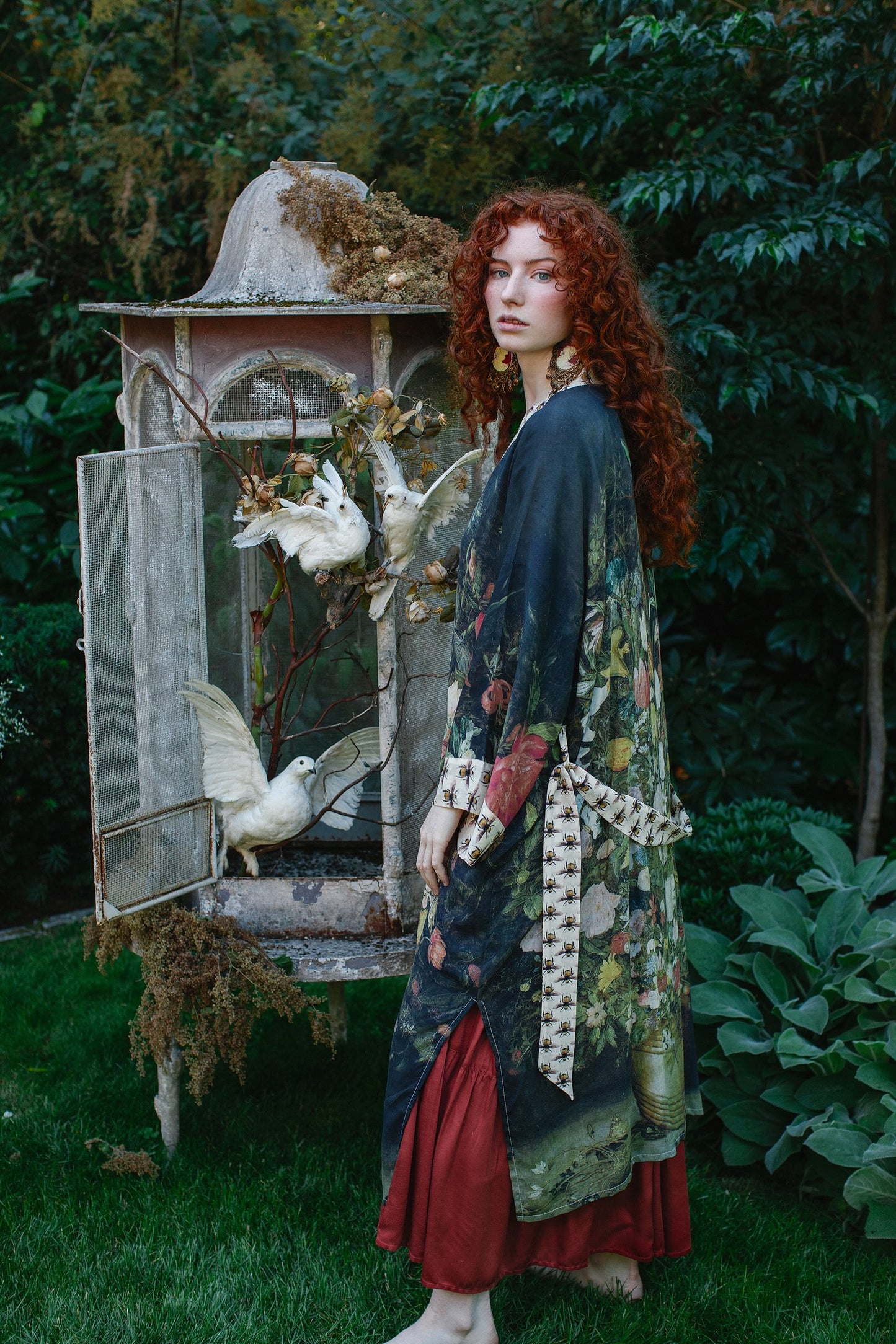 Model wearing the I Dream in Flowers Opera Duster featuring floral oil painting by Jan Brueghel and Victorian bumblebee trim – Market of Stars.