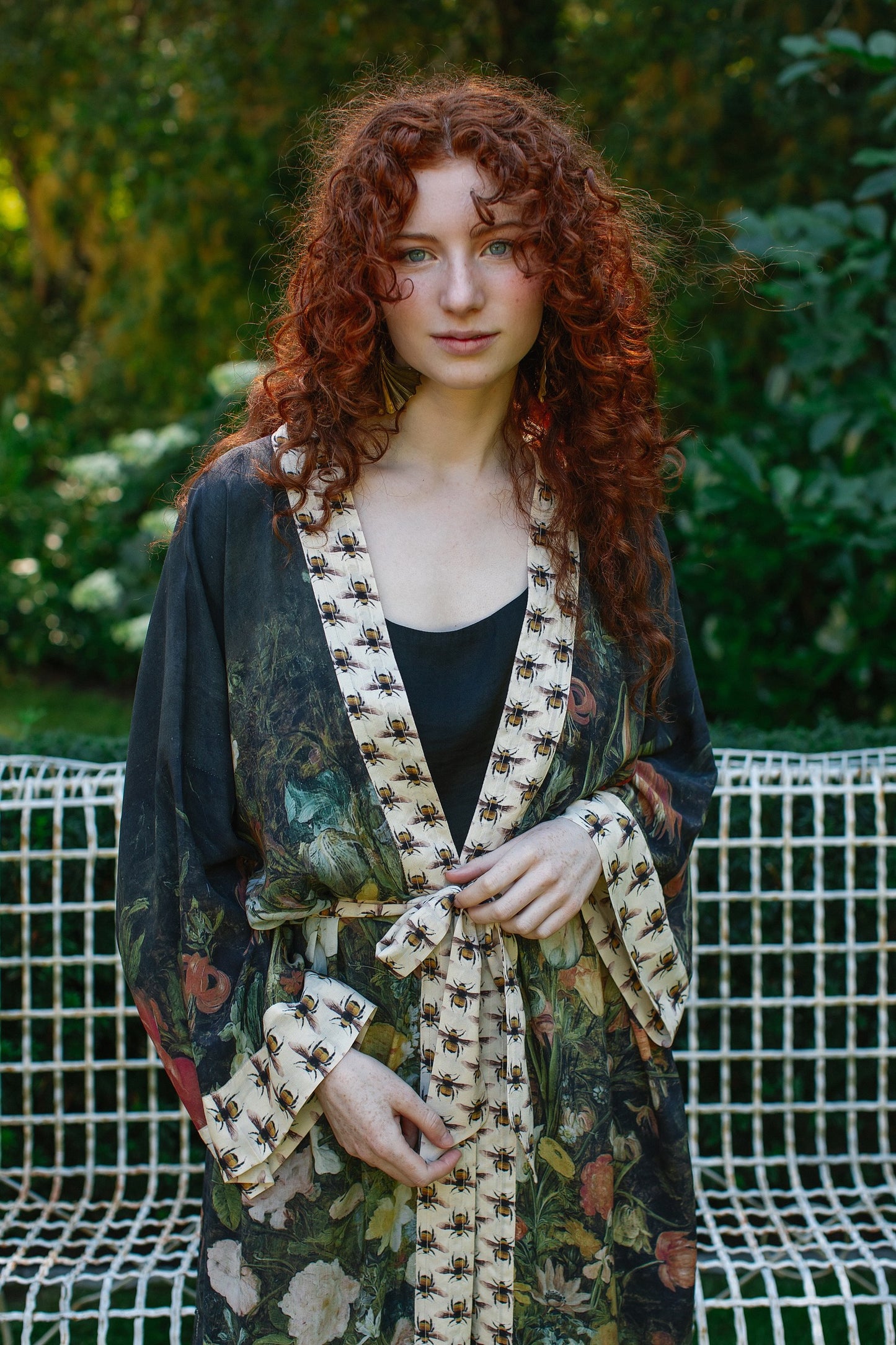 Model wearing the I Dream in Flowers Opera Duster featuring floral oil painting by Jan Brueghel and Victorian bumblebee trim – Market of Stars.