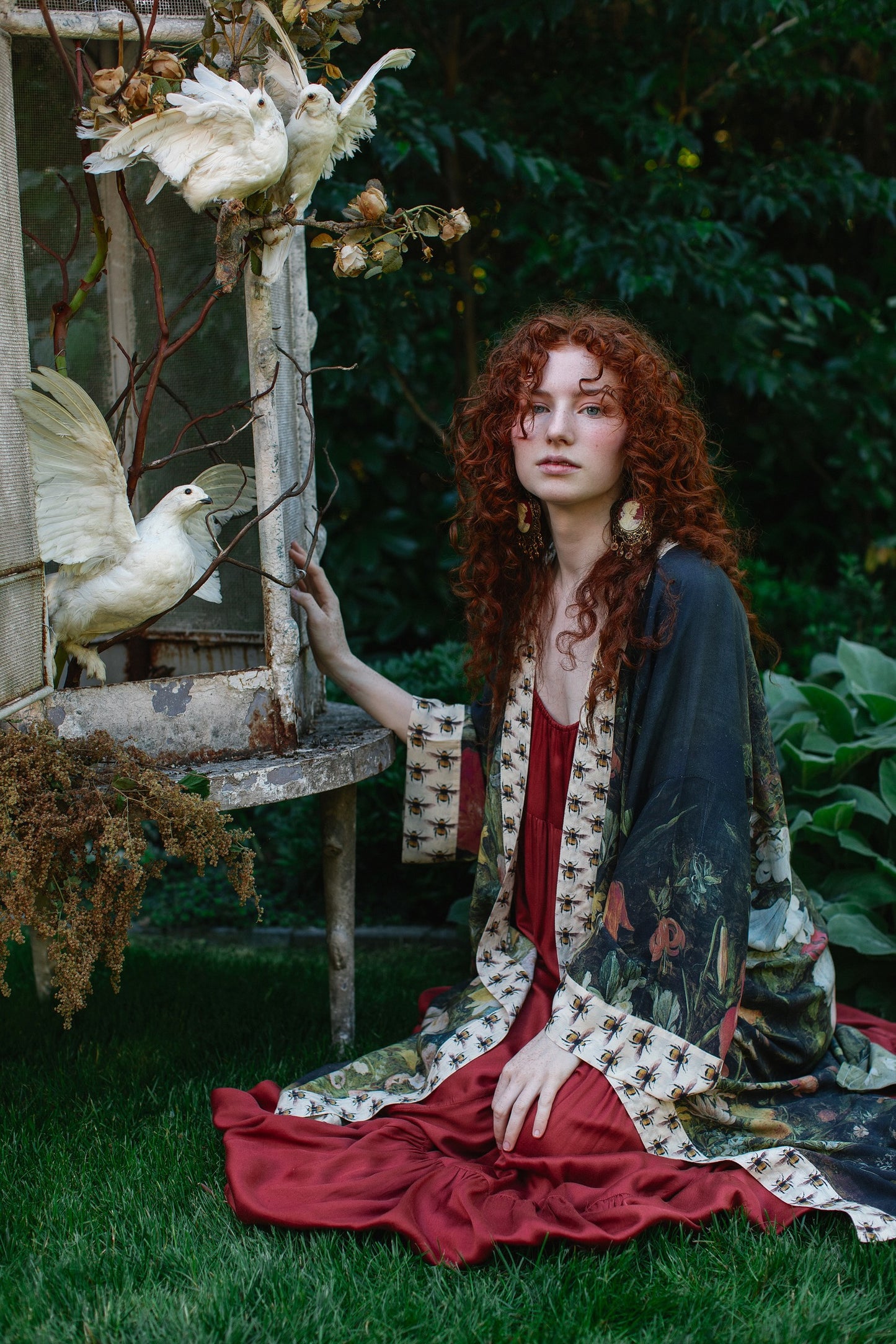 Model wearing the I Dream in Flowers Opera Duster featuring floral oil painting by Jan Brueghel and Victorian bumblebee trim – Market of Stars.