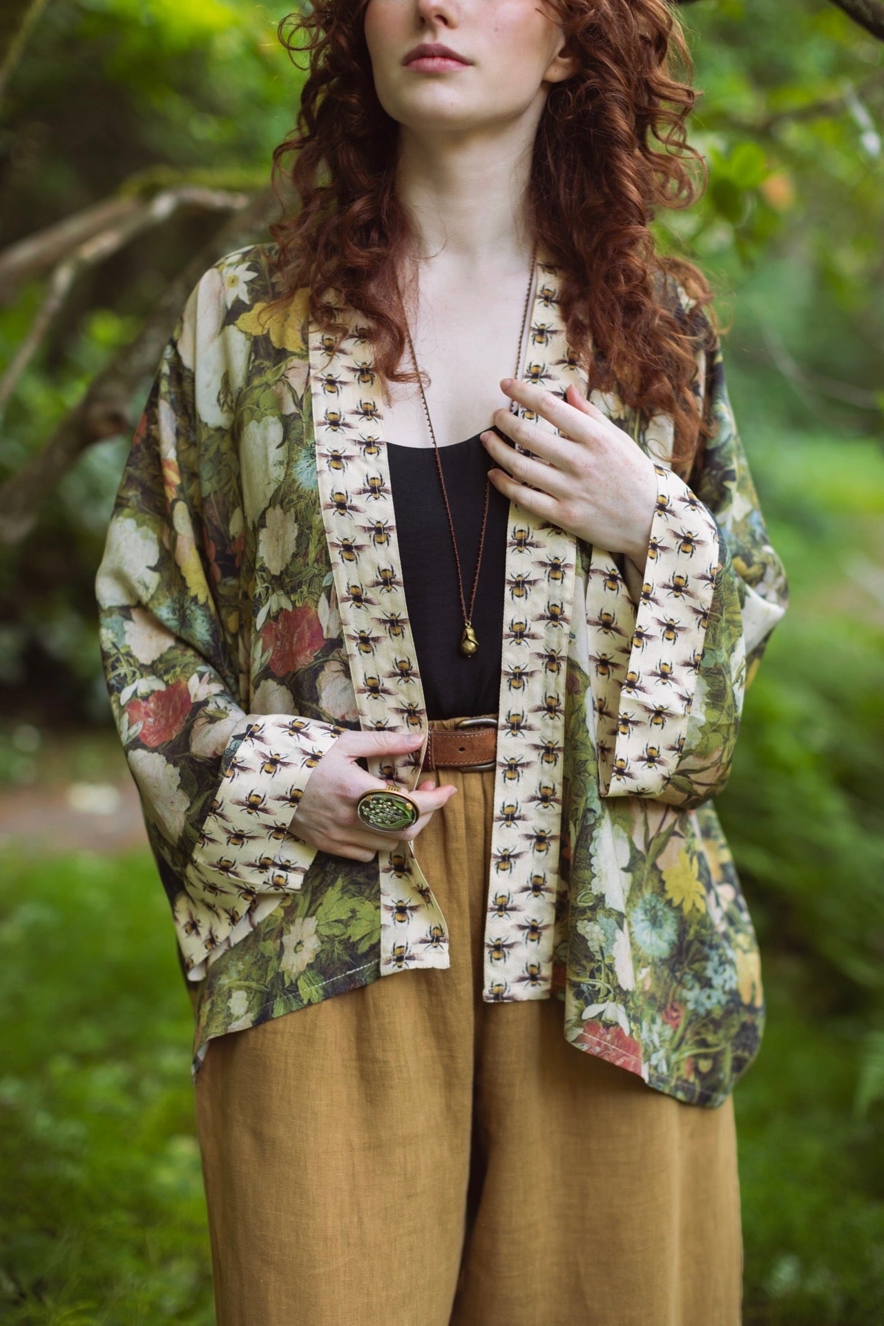 Model wearing the I Dream in Flowers cropped kimono featuring romantic floral artwork by Jan Brueghel and Victorian bumblebee trim – Market of Stars.